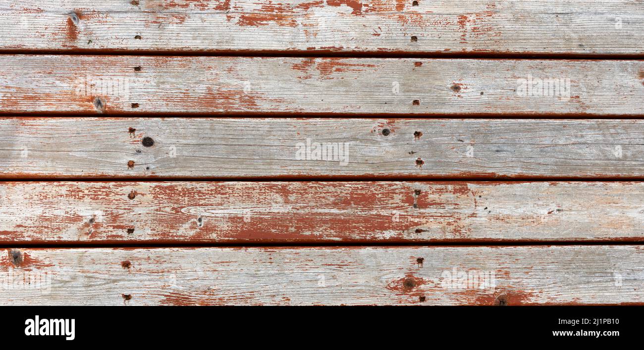 Outdoor cedar wood deck boards stripped down for staining preparation
