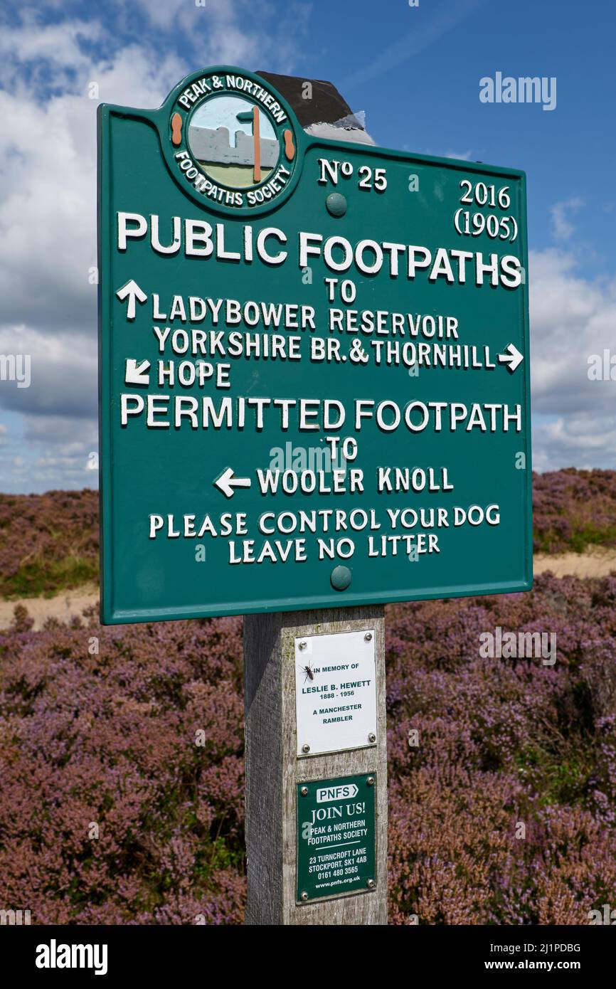 Cast metal public footpath sign on Win Hill Pike near Hope, Derbyshire, showing directions to Ladybower Reservoir, Hope, and Wooler Knoll Stock Photo