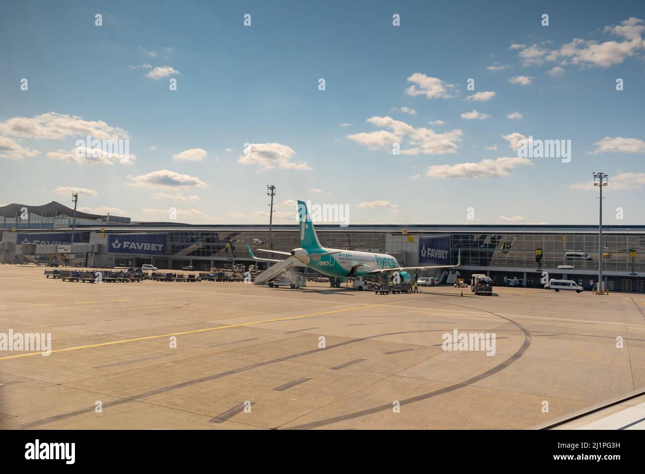 Boryspil International Airport. Terminal D and aircraft plane parking. Airplane on the apron. Flights and travel. Kyiv, Ukraine - August 3, 2021. Stock Photo
