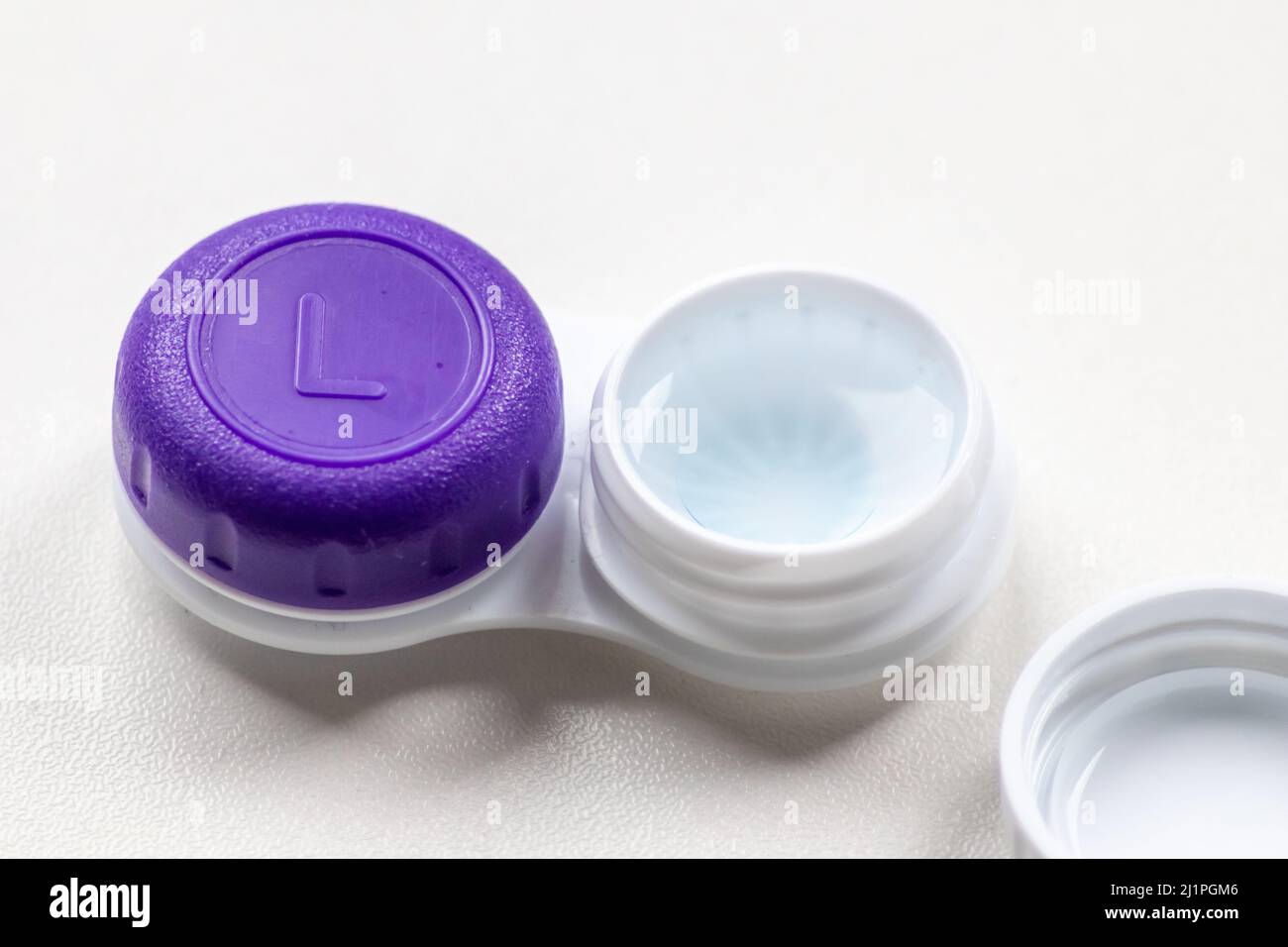 Contact lens container with contact lenses as optic alternative to