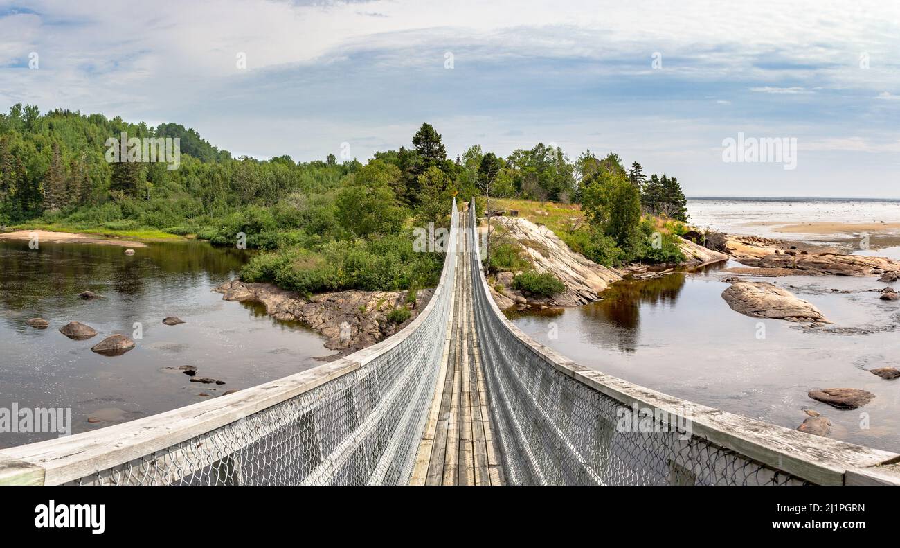 View of SaultAuMouton river with waterfalls, suspended walkway and St