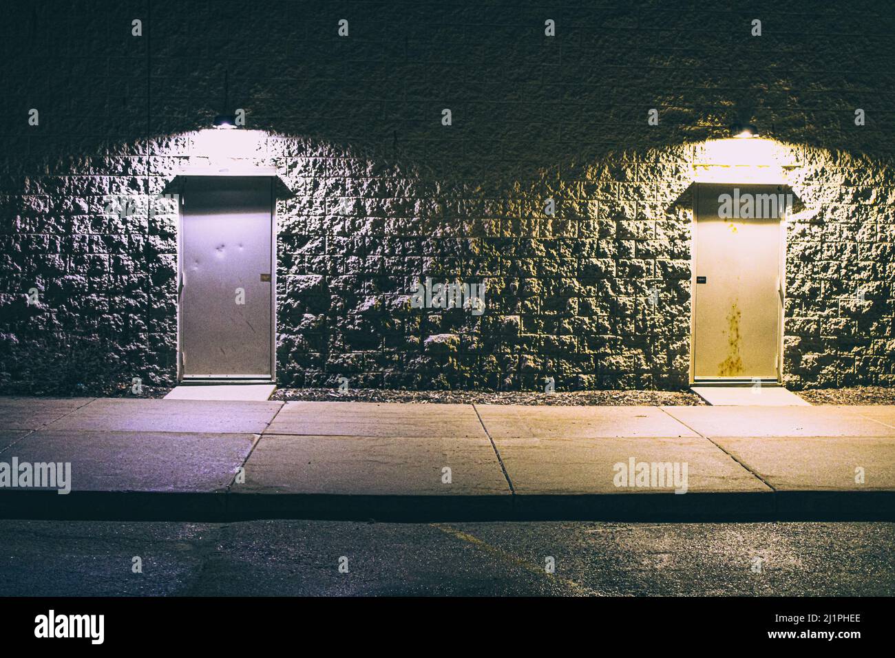 Two empty night-time doors with a creepy vibe Stock Photo