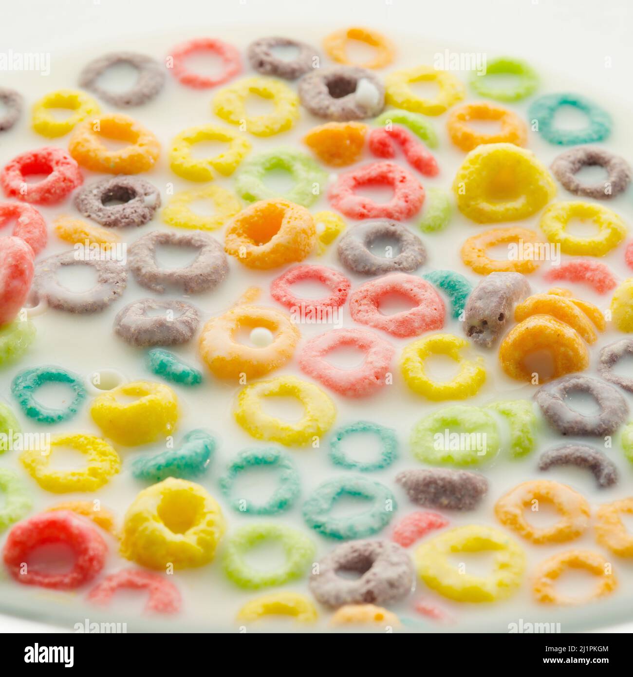 Quick breakfast cereals. Colored fruit rings in milk. Healthy baby food