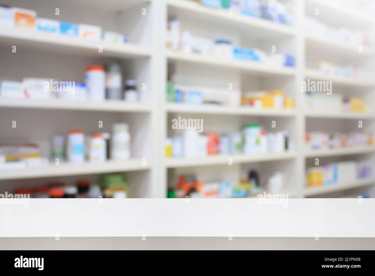 https://c8.alamy.com/comp/2J1PN08/pharmacy-product-display-counter-with-drugstore-shelves-background-2J1PN08.jpg