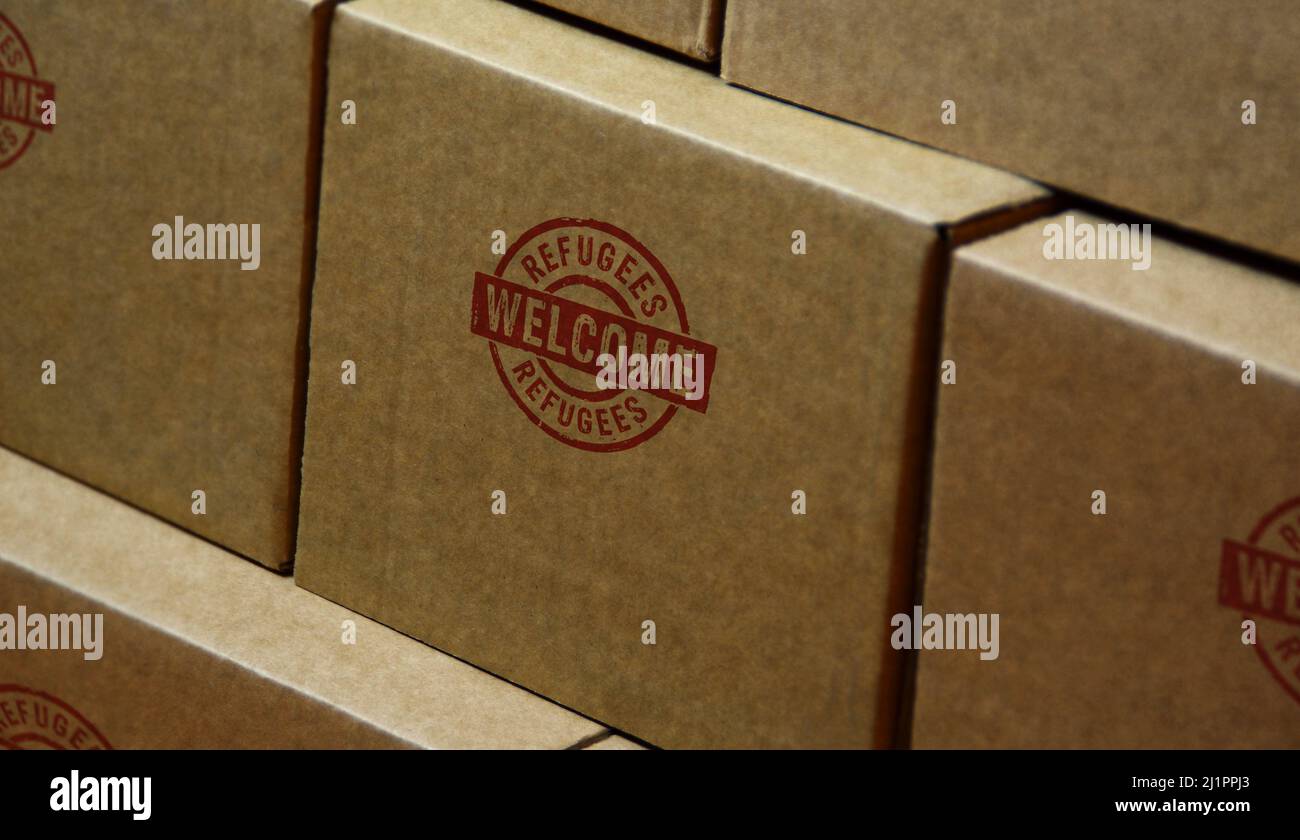 Refugees Welcome stamp printed on cardboard box. Migration and ...