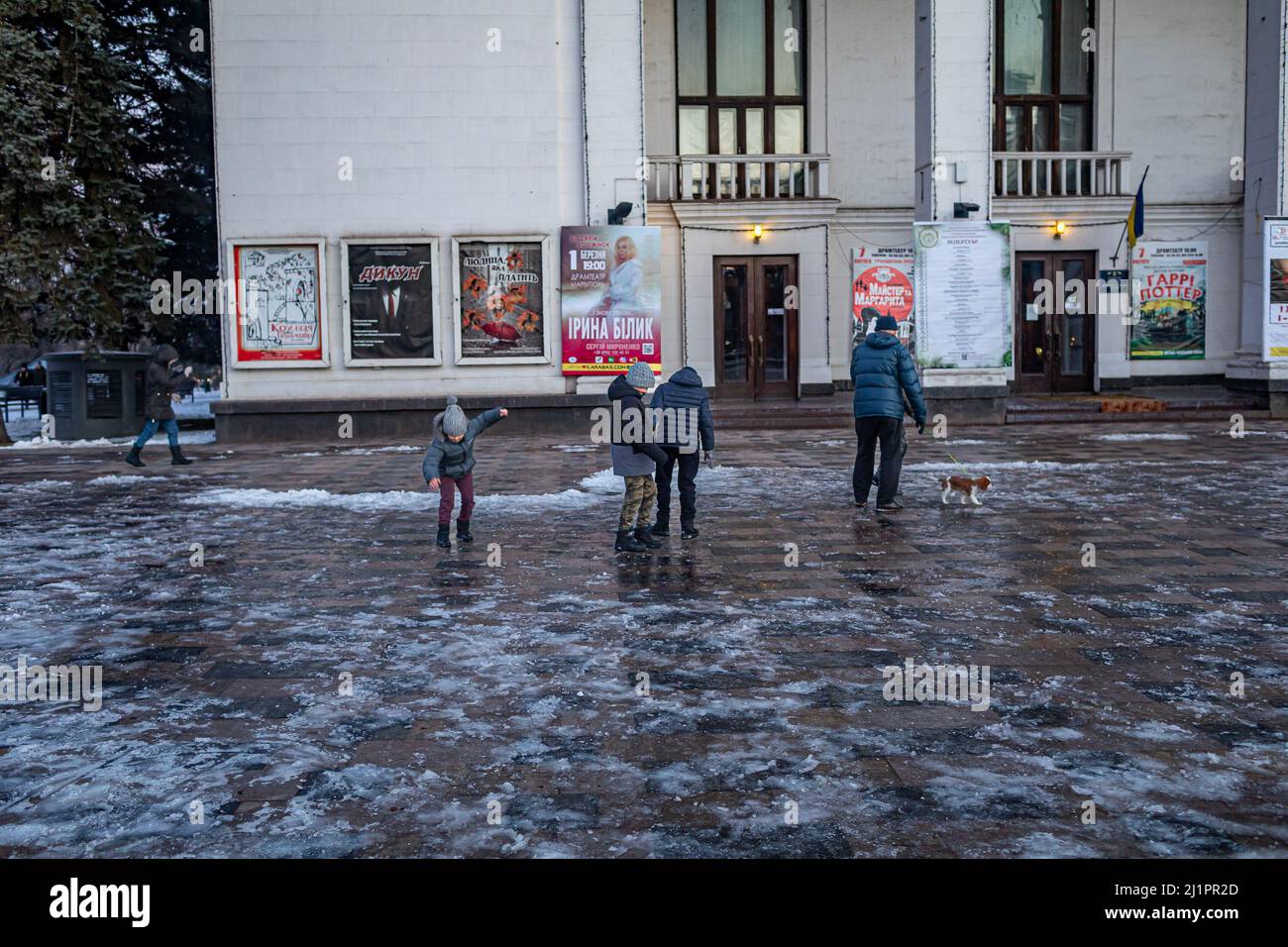 Mariupol, Ukraine. 06th Feb, 2022. A family walks past the Mariupol Theater two weeks prior to the Russian invasion of Ukraine. Ukraine Officials report that at least 300 civilians died in airstrike on Mariupol theater on March 16, 2022. Nearly 4 million people have fled Ukraine into neighboring countries since Russia launched a large-scale invasion of the country on February 24. (Photo by Michael Nigro/Sipa USA) Credit: Sipa USA/Alamy Live News Stock Photo