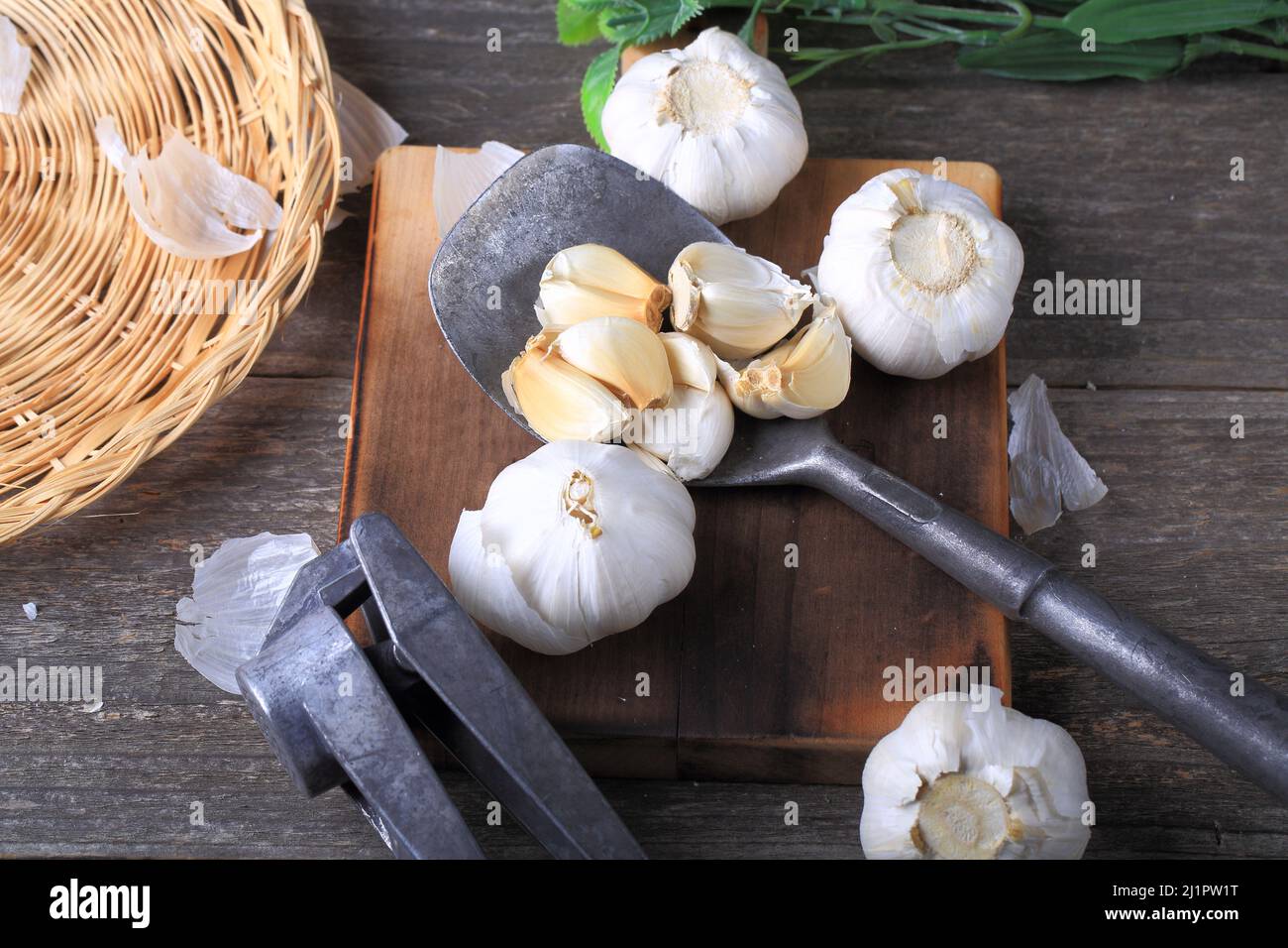 Garlic Cloves and Bulb on Wooden Background Stock Photo - Alamy