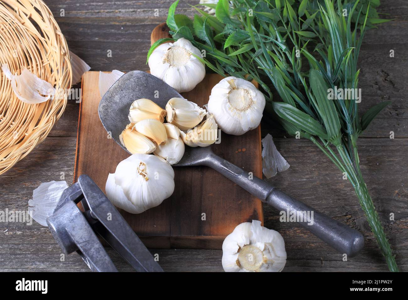 Garlic Cloves and Bulb on Wooden Background Stock Photo