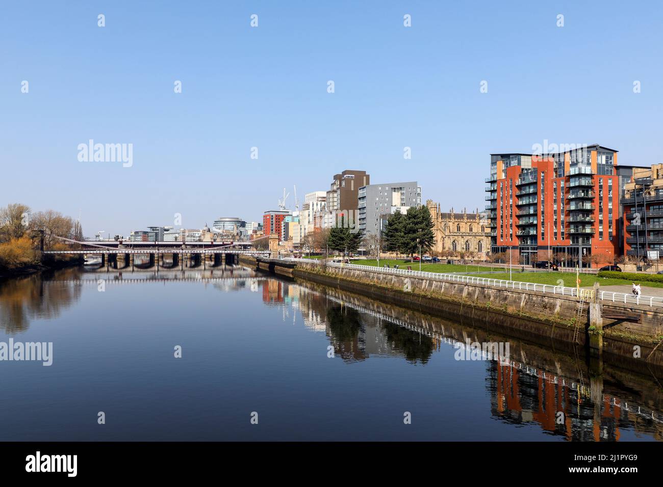 View west along the River Clyde towards the South Portland Street suspension bridge with the Victoria Bridge behind and the Broomielaw walkway is to t Stock Photo