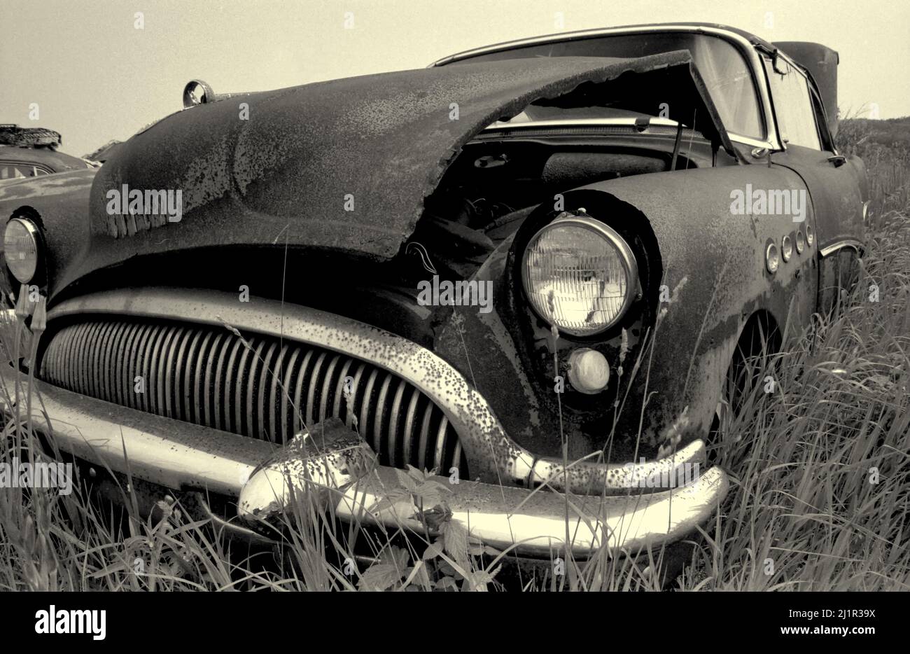Buick in scrap yard, Black and White image. Ontario Canada Stock Photo