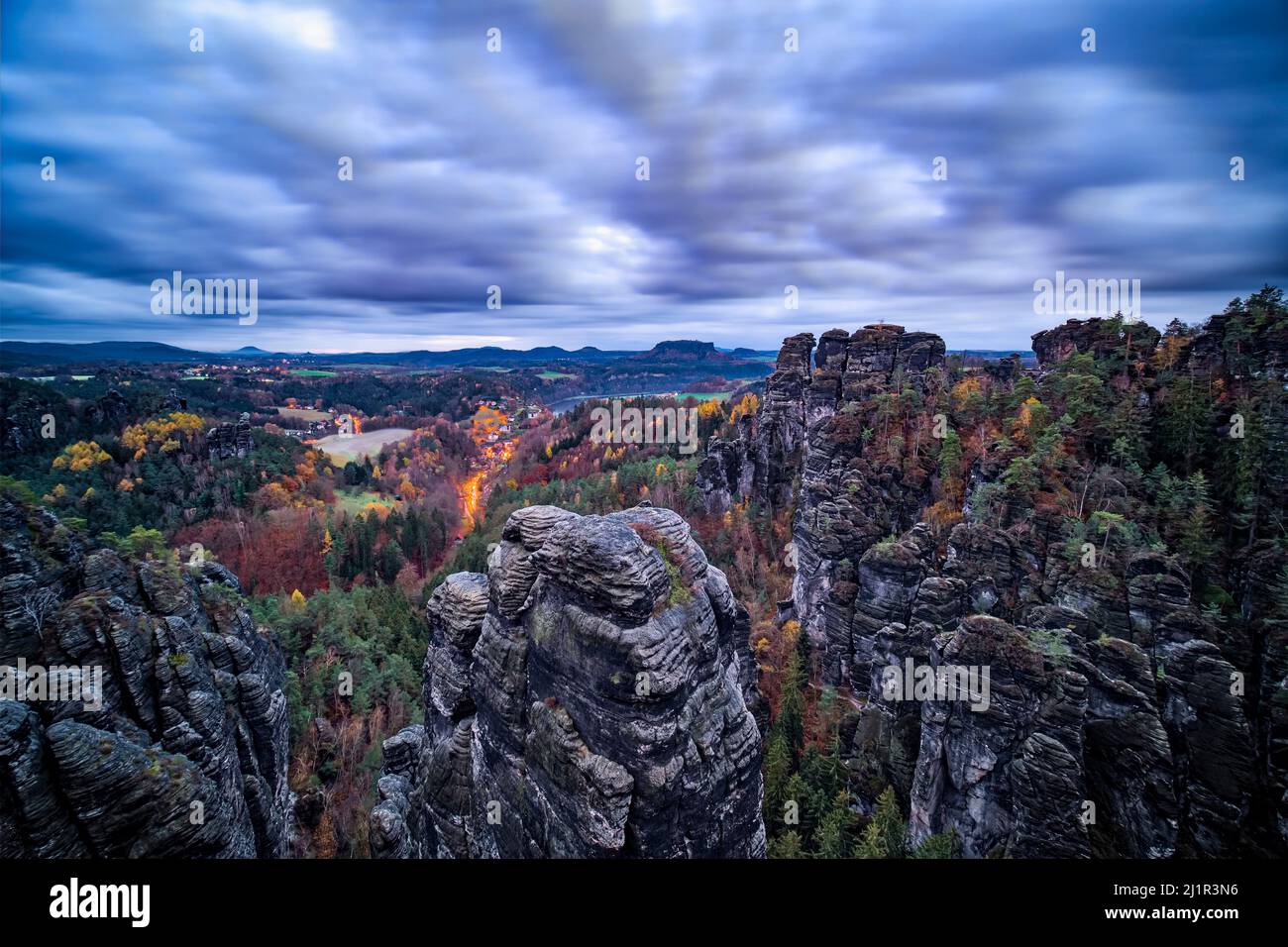 Landscape with rock formations, the summits Hintere Gans and Höllenhund in Rathen area of the Saxon Switzerland National Park early morning in autumn. Stock Photo