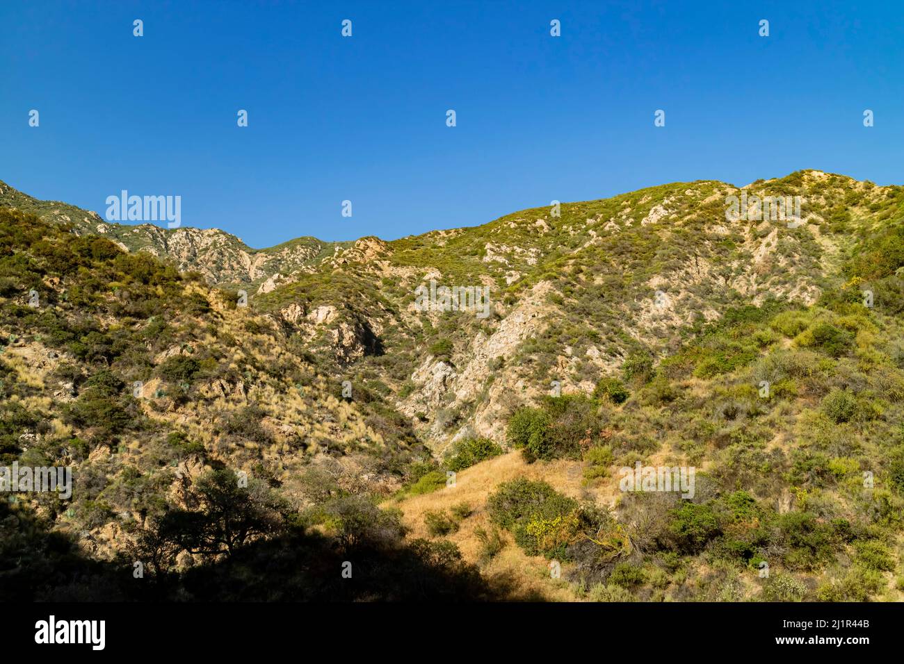 Sunny view of hiking in a rural trail of San Gabriel Mountains at Los