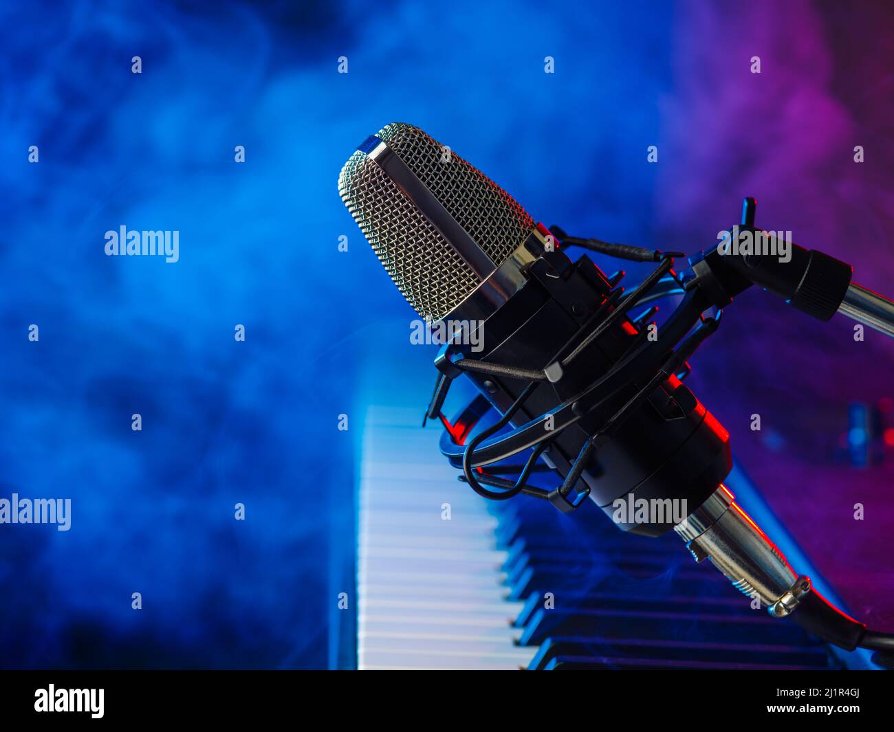 Musical instrument midi keyboard and microphone for singing on a blue