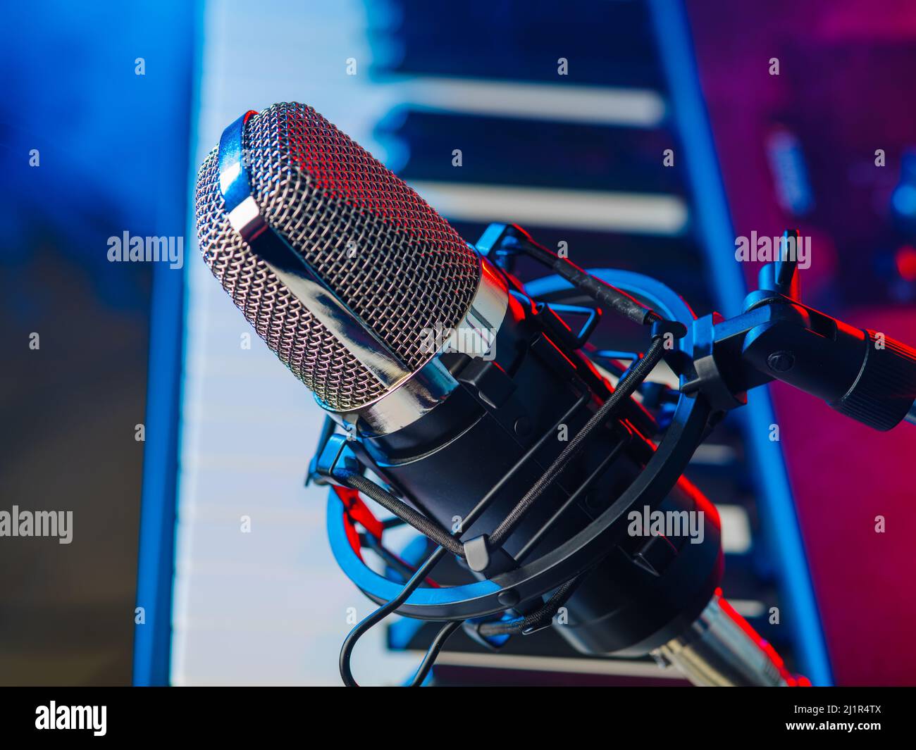 Closeup. Modern microphone and midi keyboard, modern synthesizer