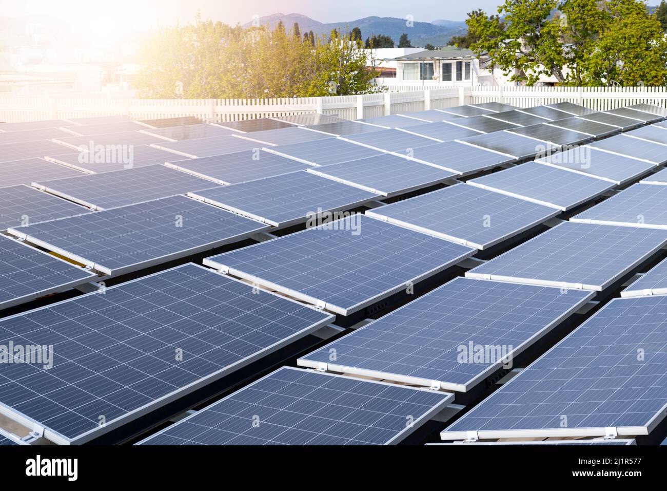 Close up photo of installed solar panels on the roof of building. Clean ...