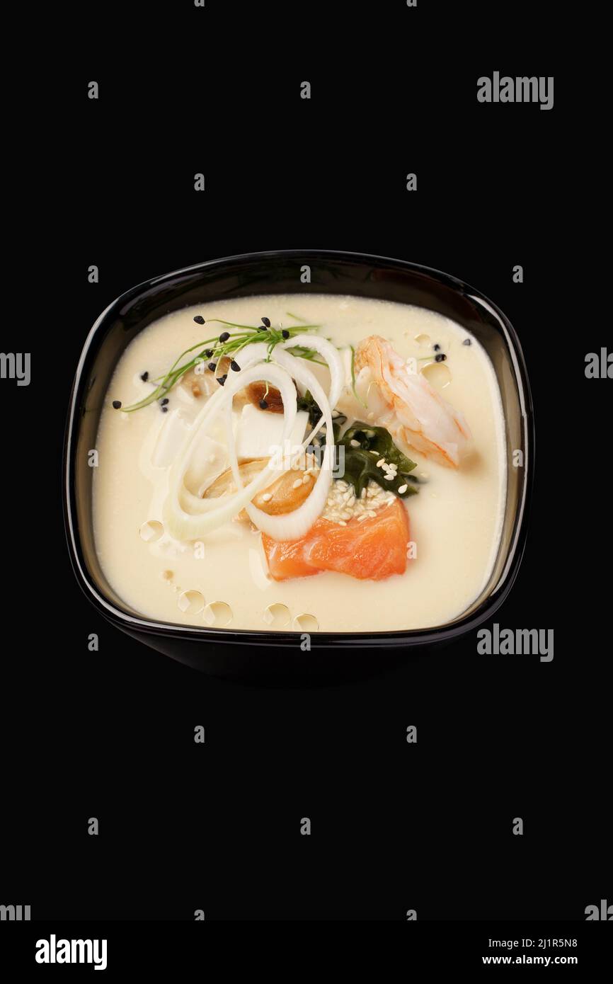 Thai soup with seafood, salmon, tiger shrimp, mussels, hondashi