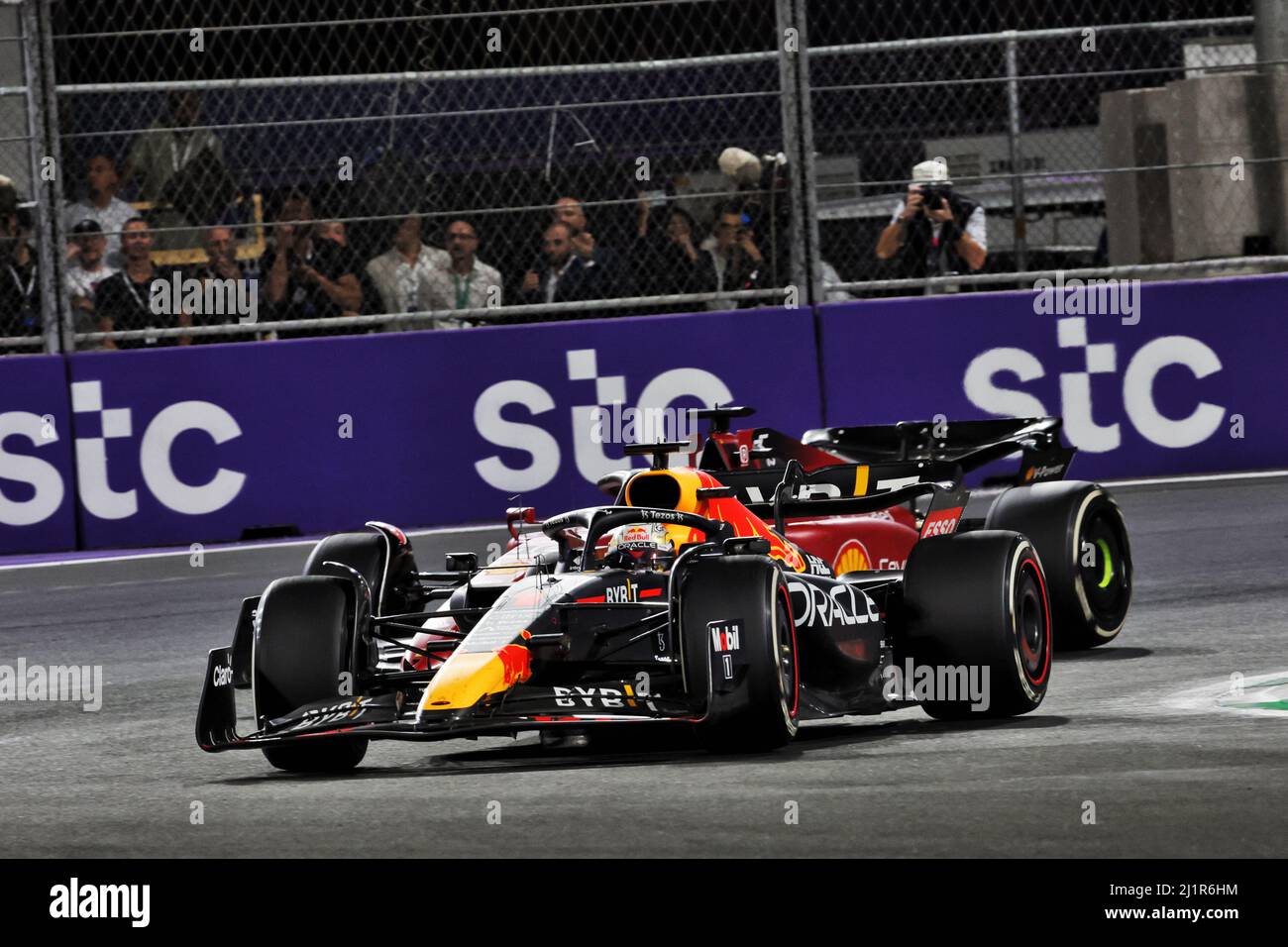 Jeddah, Saudi Arabia. 27th Mar, 2022. Max Verstappen (NLD) Red Bull Racing RB18 leads Charles Leclerc (MON) Ferrari F1-75