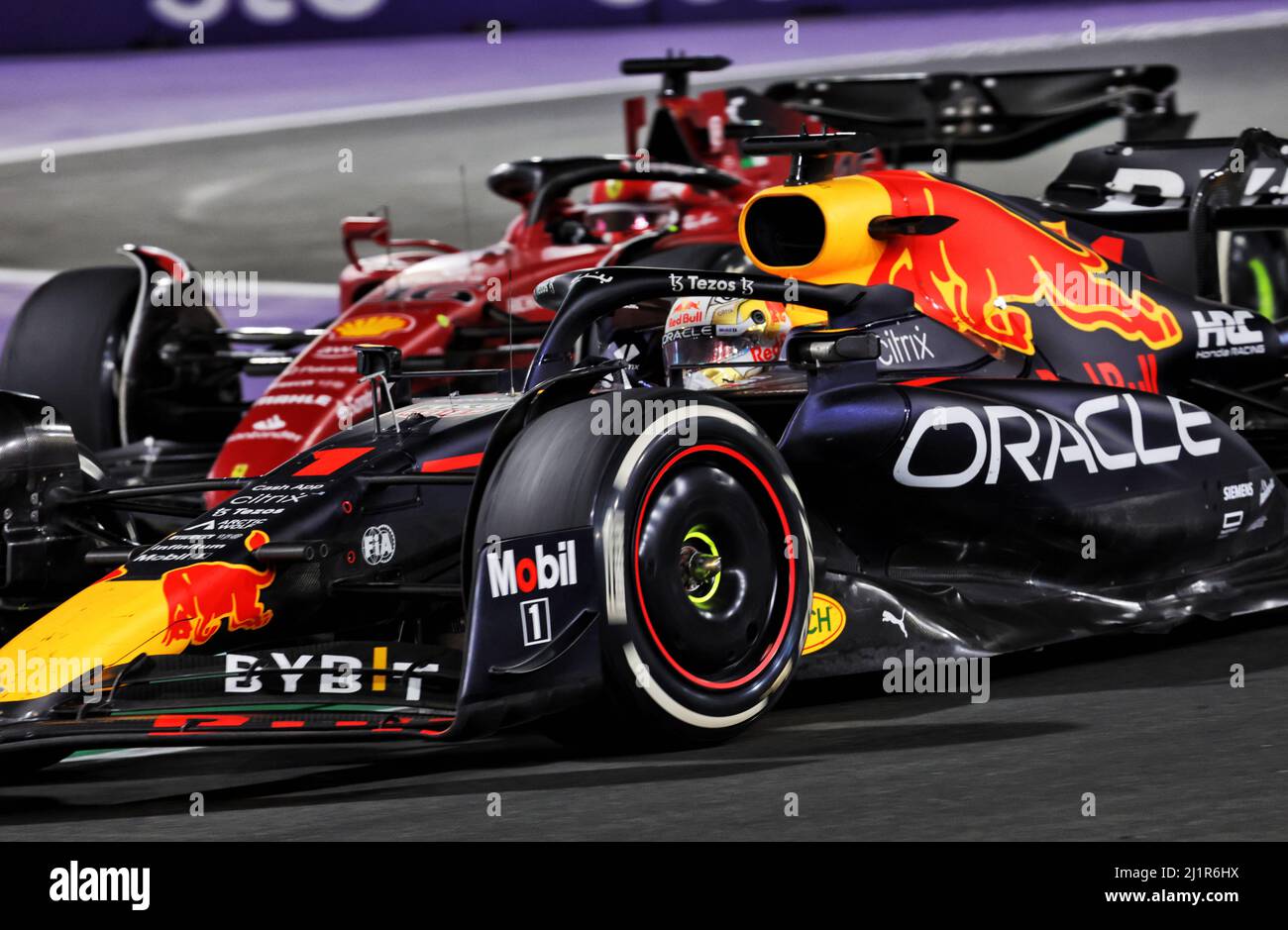 Jeddah, Saudi Arabia. 27th Mar, 2022. Max Verstappen (NLD) Red Bull Racing RB18 leads Charles Leclerc (MON) Ferrari F1-75