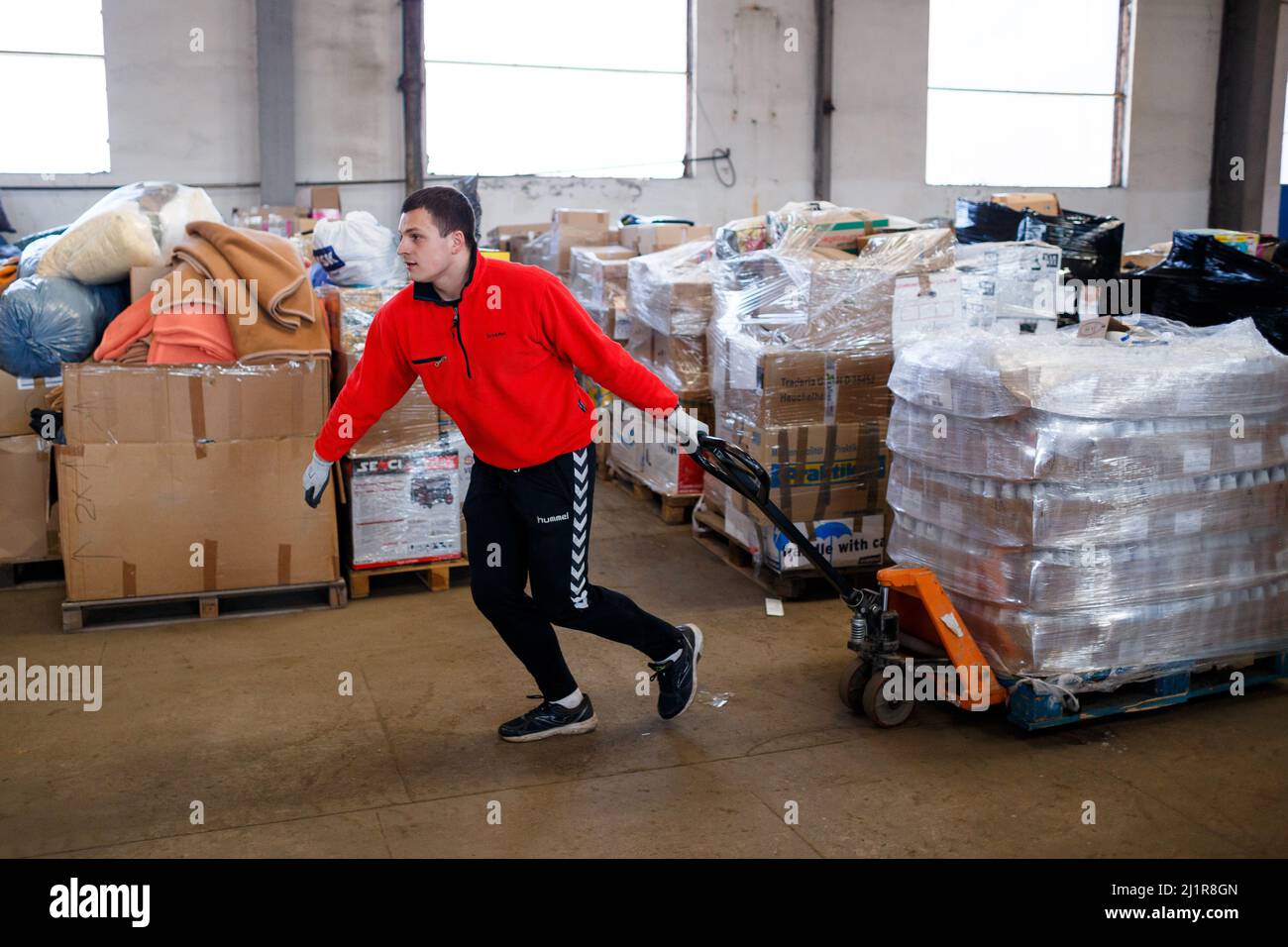 UZHHOROD, UKRAINE - MARCH 8, 2022 - A volunteer sorts through food  donations at a local centre that collects and distributes humanitarian aid  for inte Stock Photo - Alamy