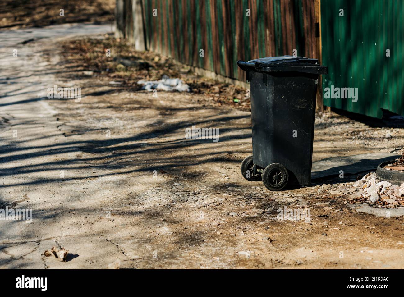 garbage bin in front of the house.Public trash on the side of the road