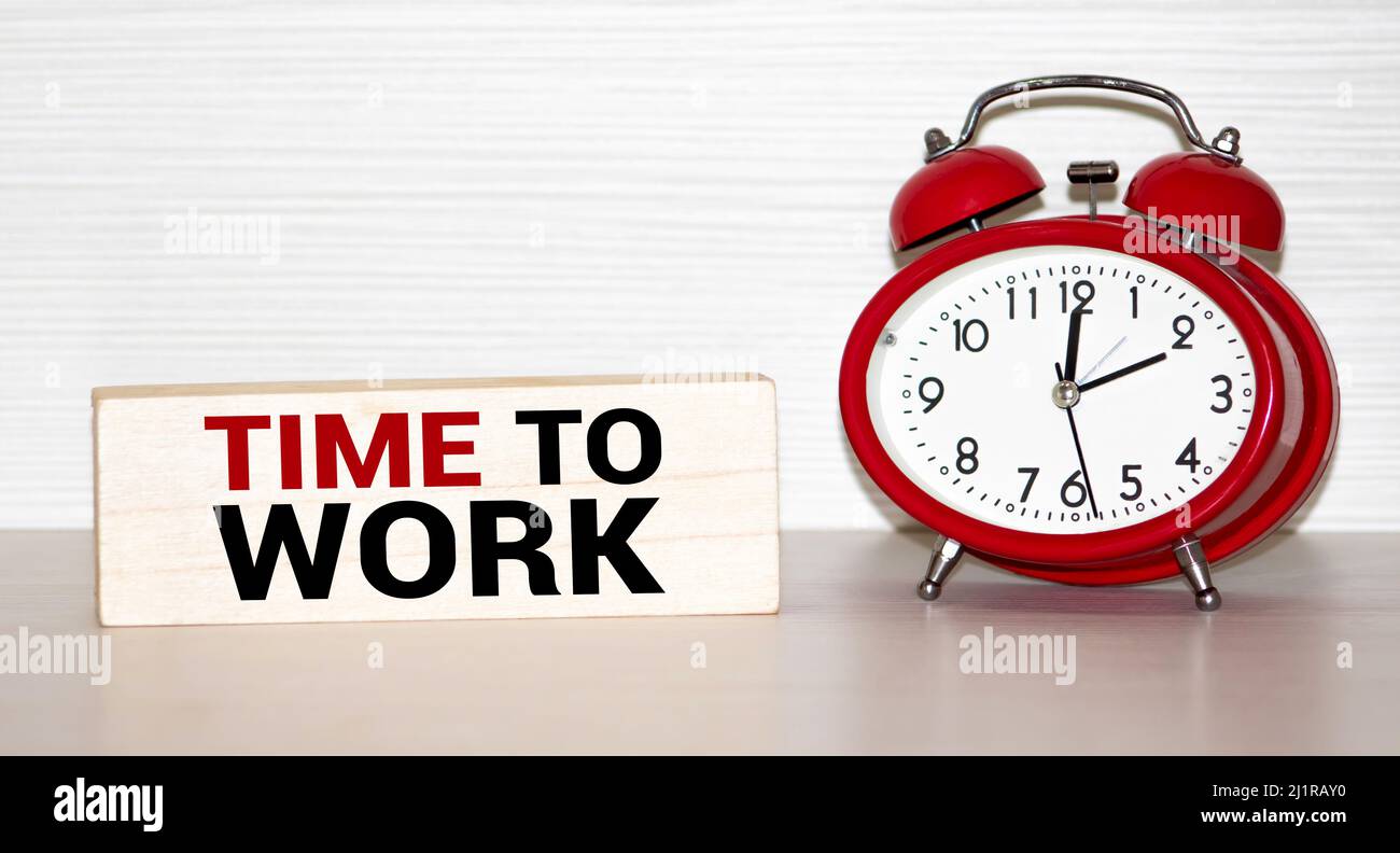 Work time word on notepad. Time to work. The alarm clock Stock Photo