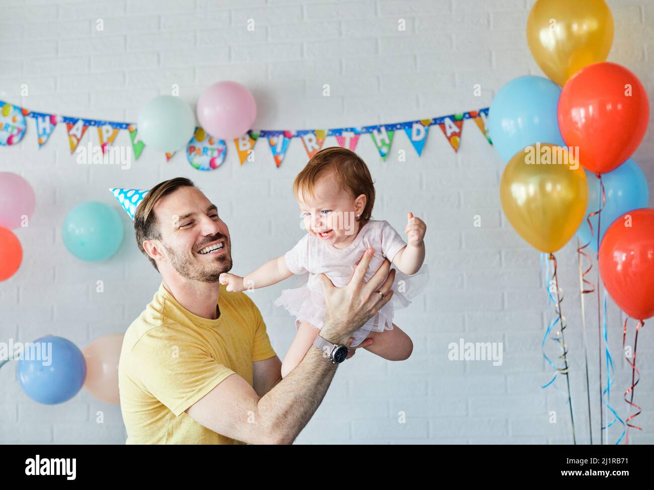 child birthday family daughter baby celebration girl happy party father cake parent baby Stock Photo
