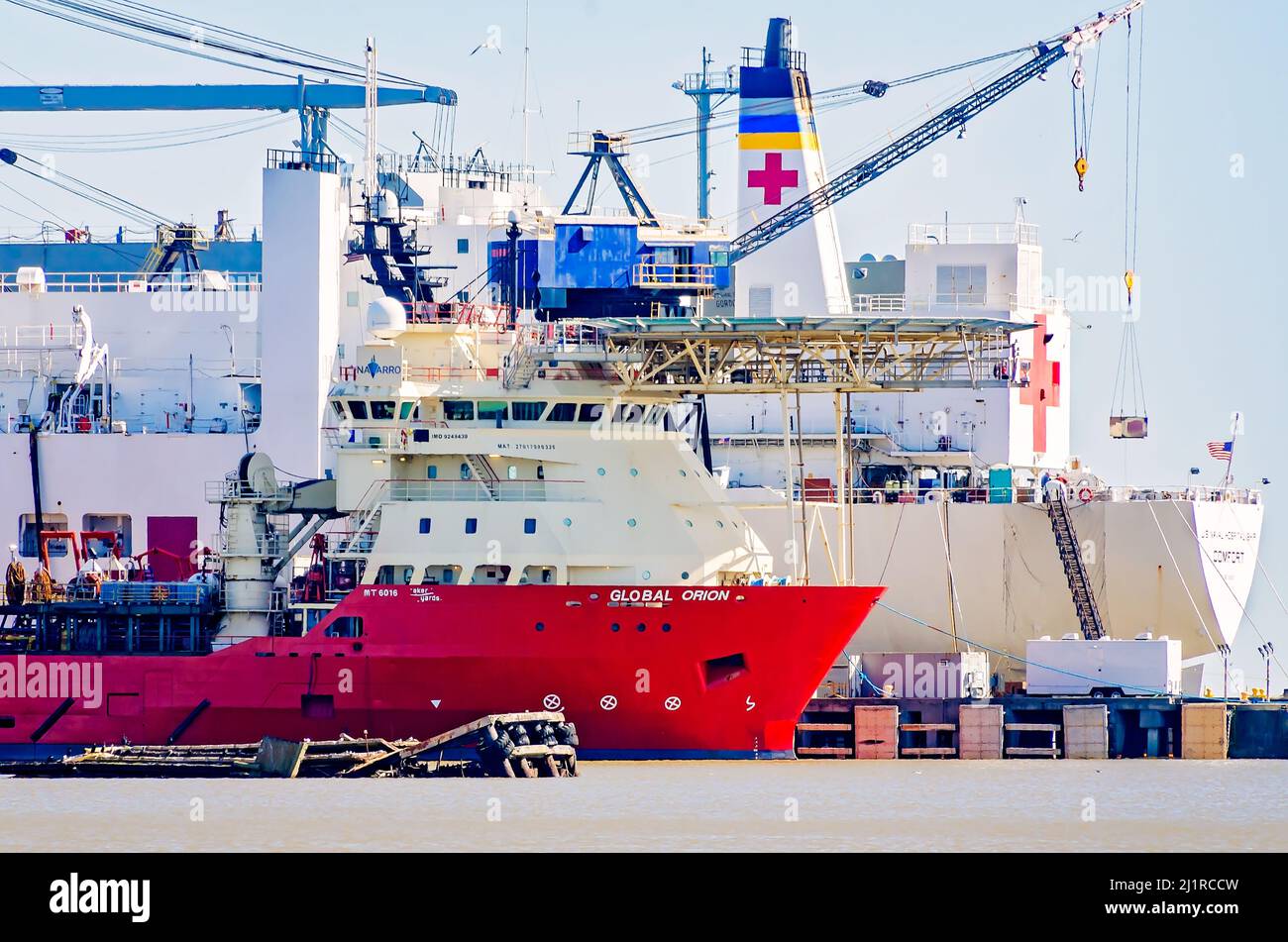 The Global Orion offshore supply vessel is docked alongside the USNS Comfort Navy hospital ship at Alabama Shipyard, March 25, 2022, in Mobile, Alabam Stock Photo