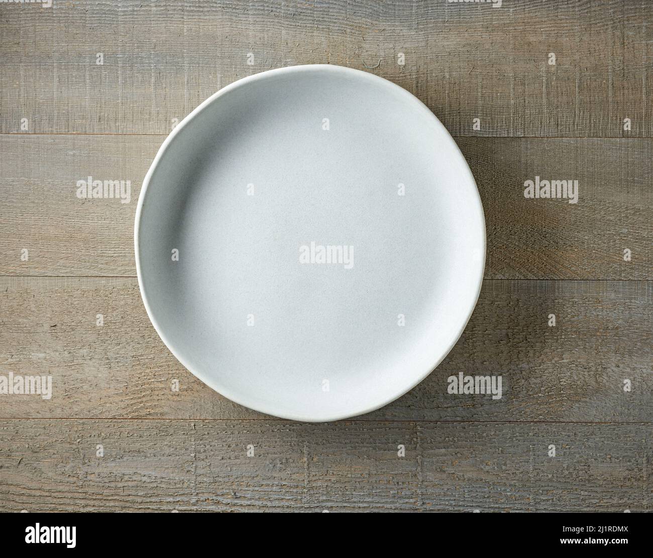 empty plate on wooden table, top view Stock Photo