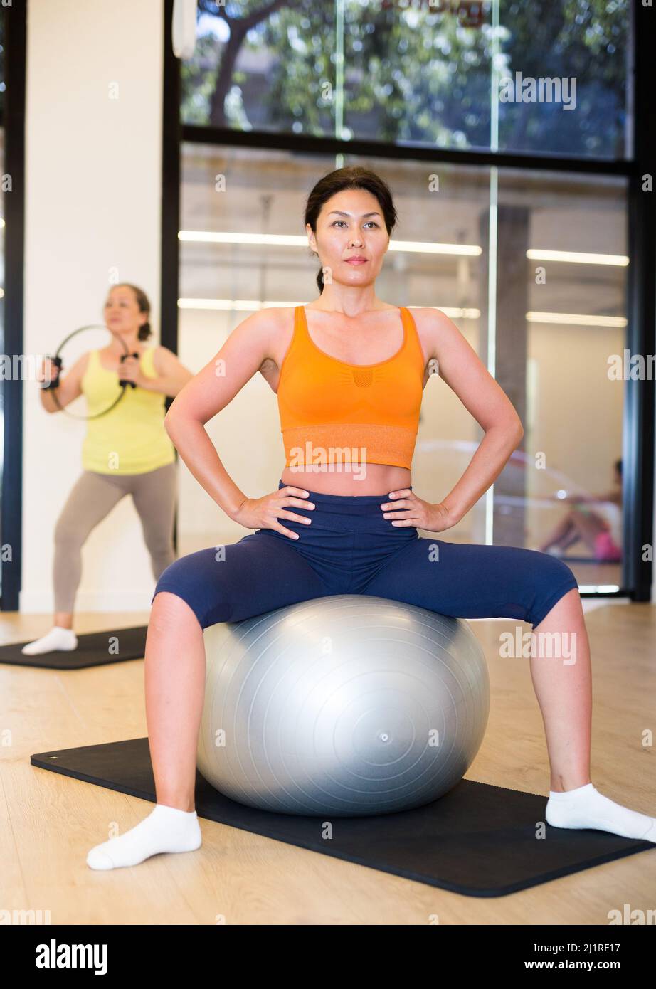 Women of various ages on stability balls Stock Photo