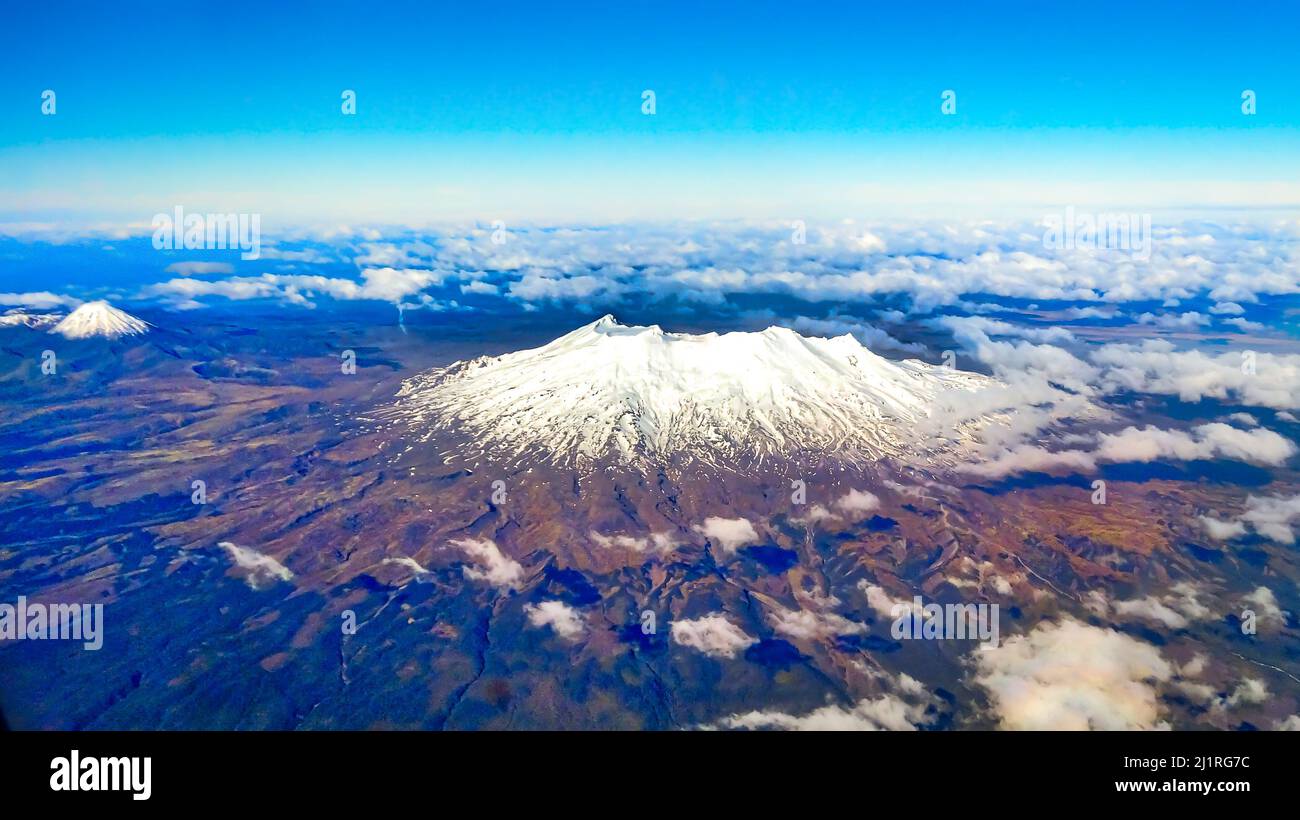 The two volcanos of Mount Ruapehu and Mt Taranaki seen from the air Stock Photo