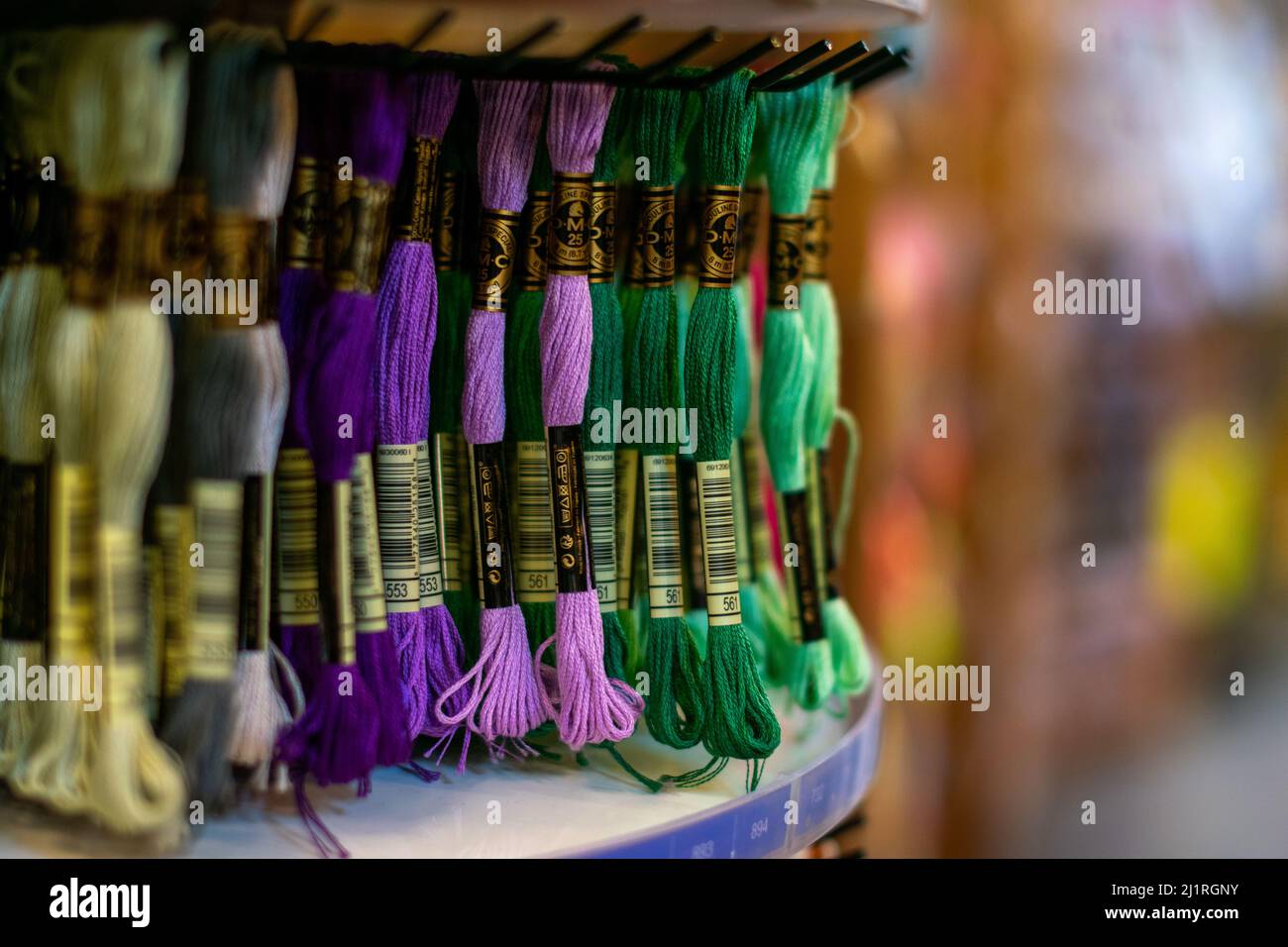 Thame,UK-Sept 2021: Various colors moulin threads hanging on store display, embroidery thread mouline for hobby and craft, popular for knotting Stock Photo
