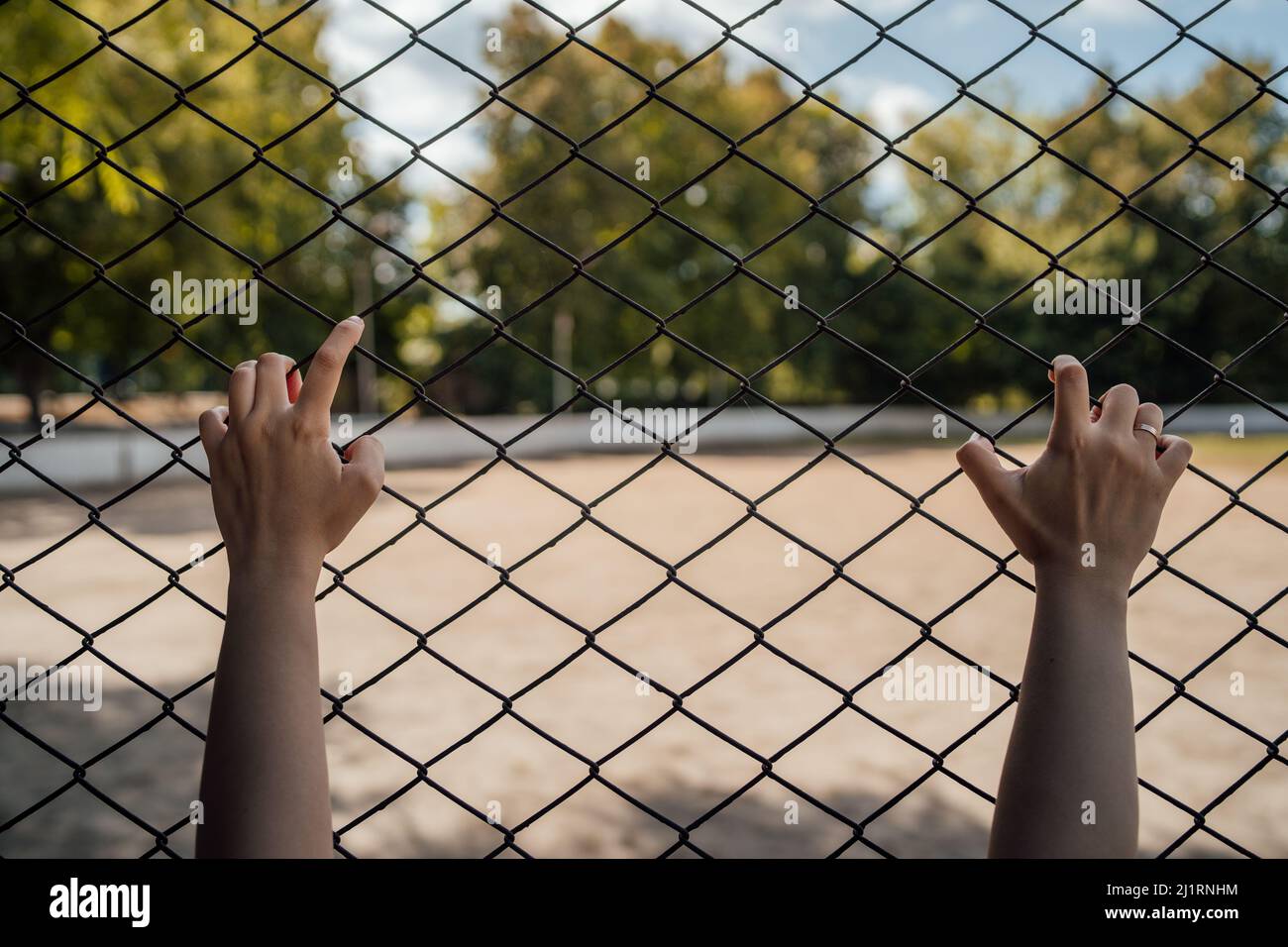 The hands on the lattice are symbolize limitation in something. Stock Photo