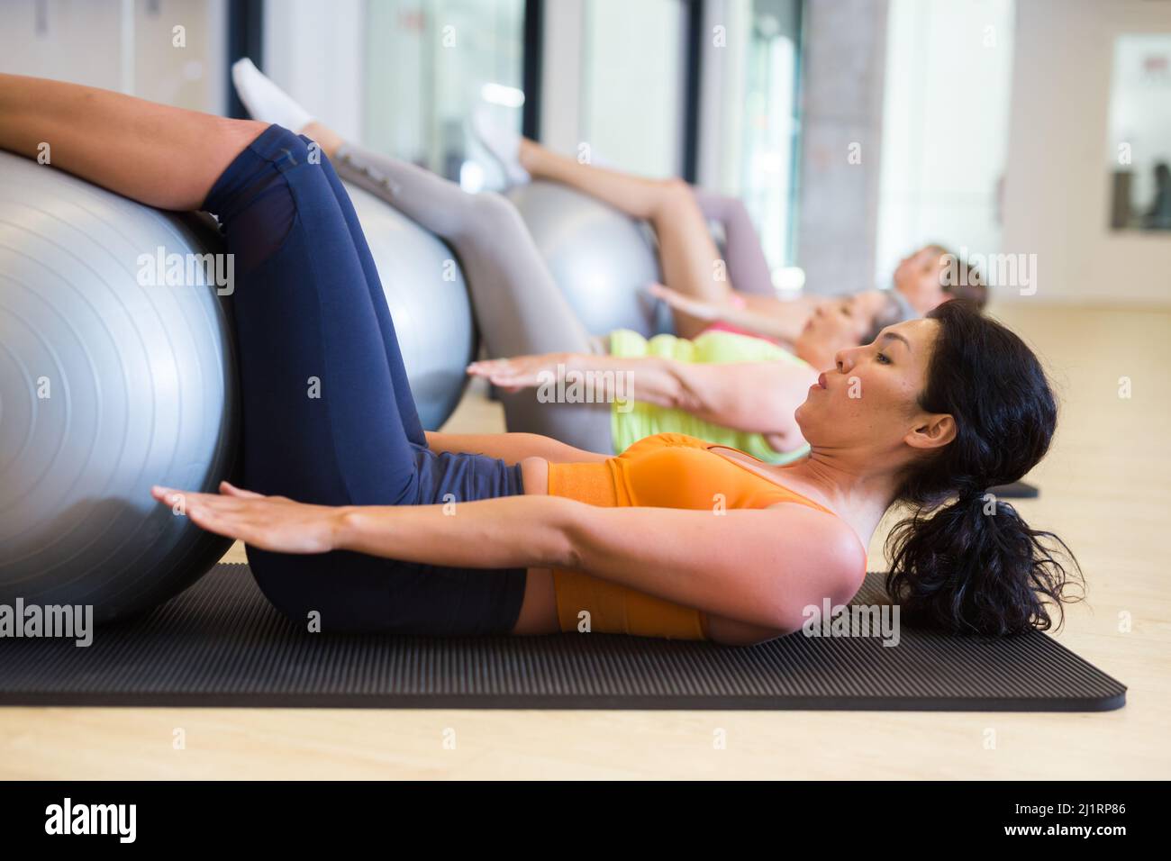 Pilates - women with exercise ball Stock Photo