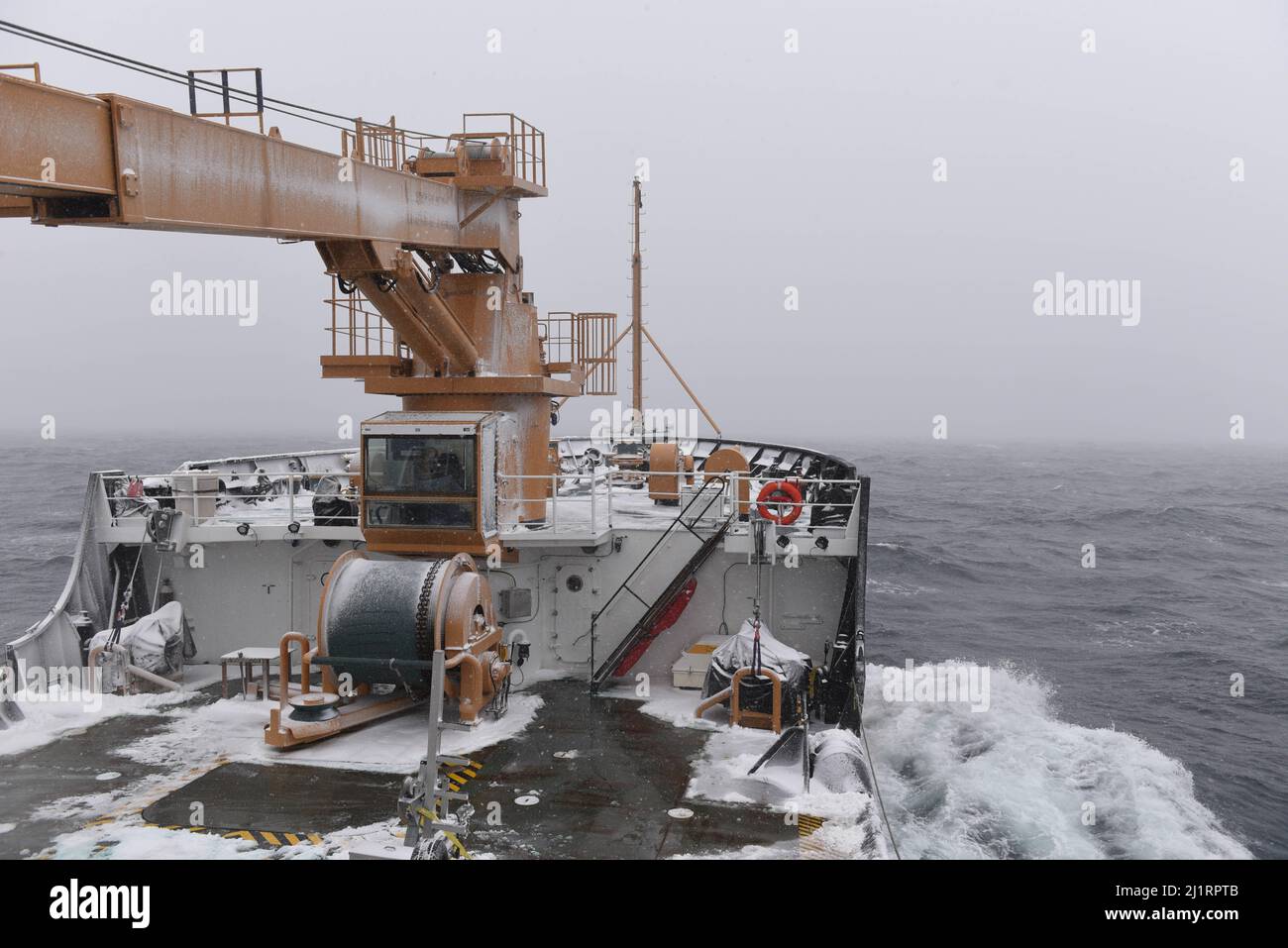 U.S. Coast Guard Cutter Spar underway with limited visibility in the Atlantic Ocean during its homebound transit to Duluth, Minn. after a year-long maintenance period in Baltimore, March 20, 2022. CGC Spar is a 225’ Juniper Class Buoy Tender and the newest addition to the Coast Guard Ninth District fleet. (U.S. Coast Guard photo by Petty Officer 3rd Class Gregory Schell) Stock Photo