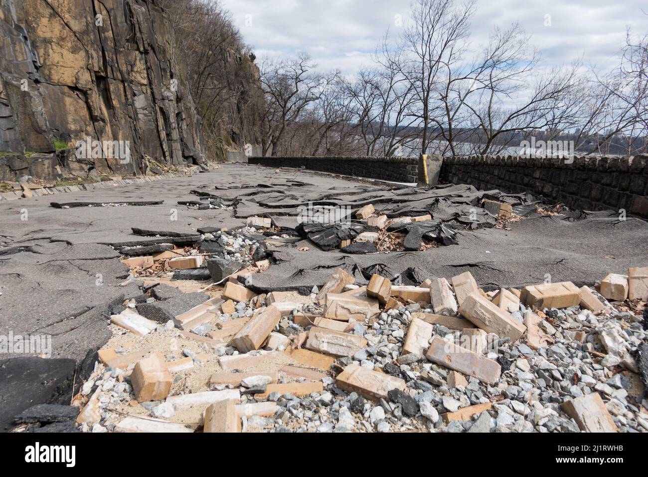 Aftermath of the hurricane, tropical storm Ida - damaged pavement on Dyckman Hill Road, Englewood Cliffs entrance to the Palisades Interstate Park, NJ Stock Photo