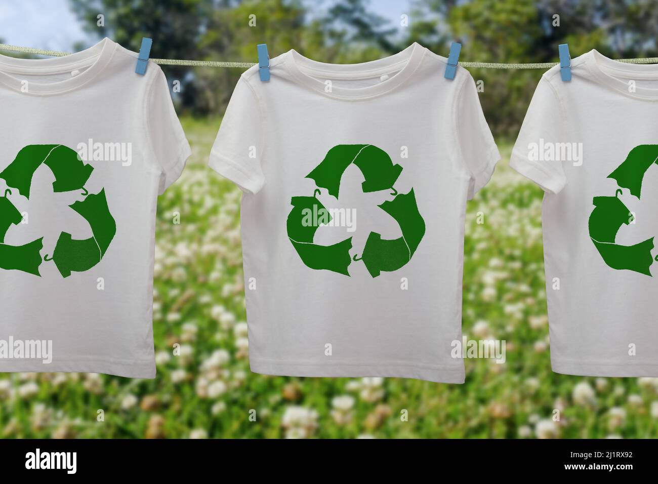 Recycle clothes icon on t shirts on line, sustainable fashion concept reuse, recycle clothes and textiles to reduce waste Stock Photo