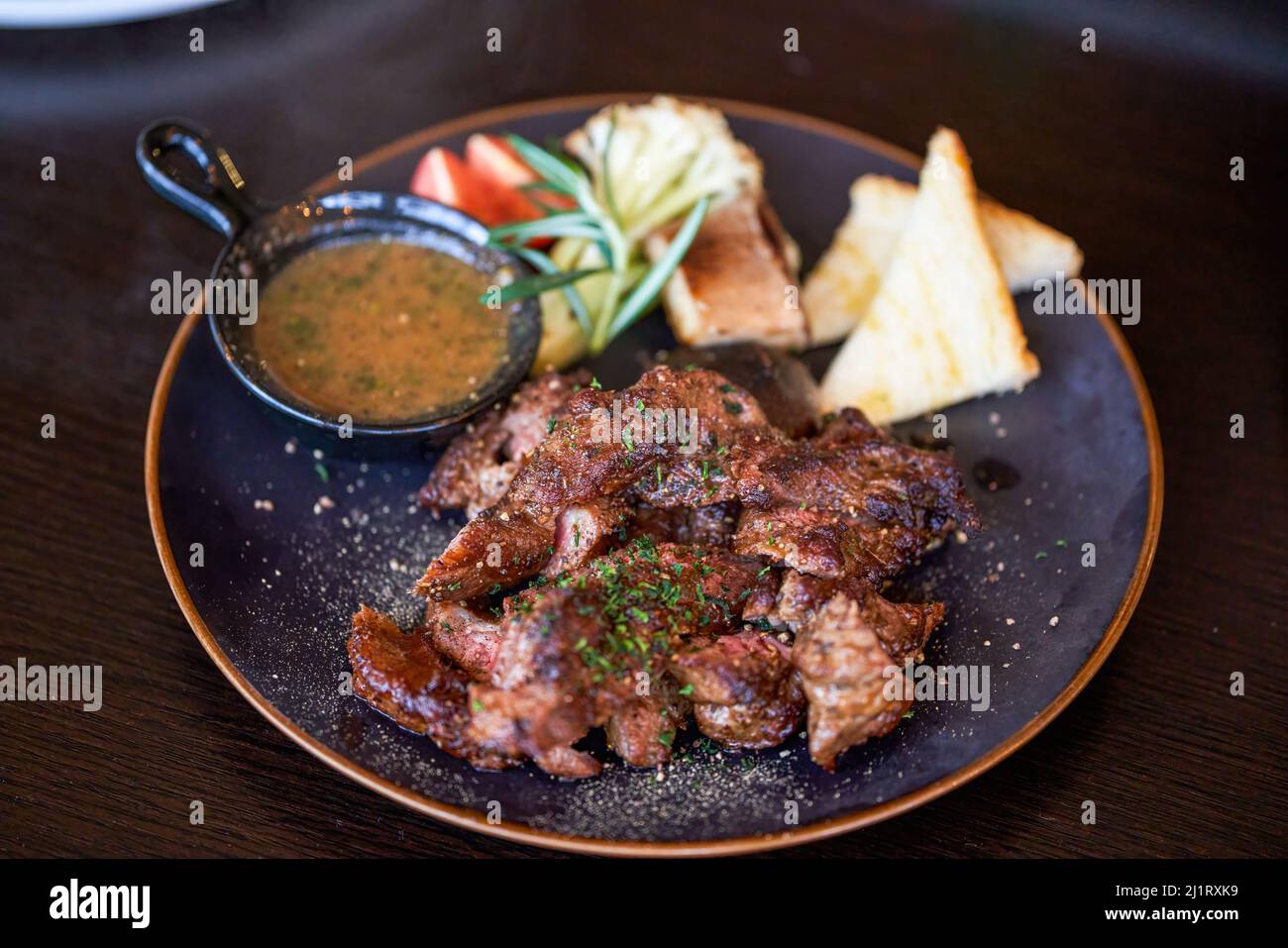 A delicious and tempting western steak, smoked grilled sirloin steak Stock Photo