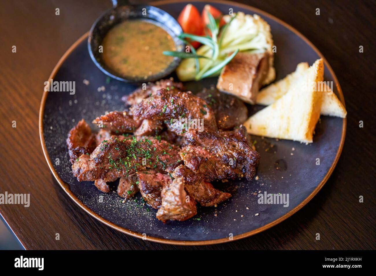 A delicious and tempting western steak, smoked grilled sirloin steak Stock Photo