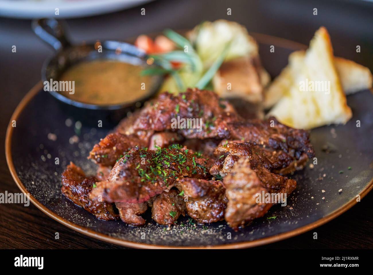 A delicious and tempting western steak, smoked grilled sirloin steak Stock Photo