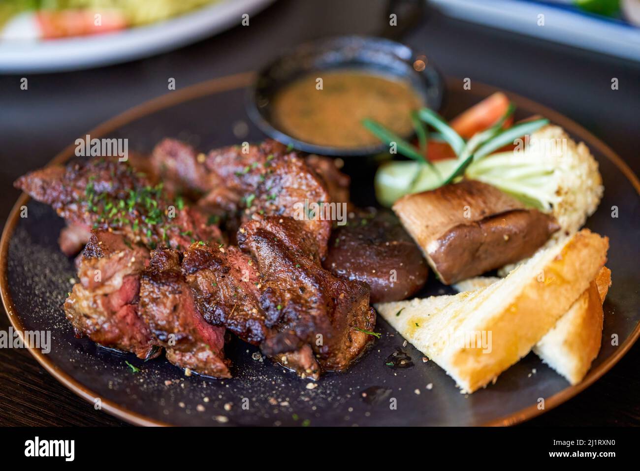 A delicious and tempting western steak, smoked grilled sirloin steak Stock Photo