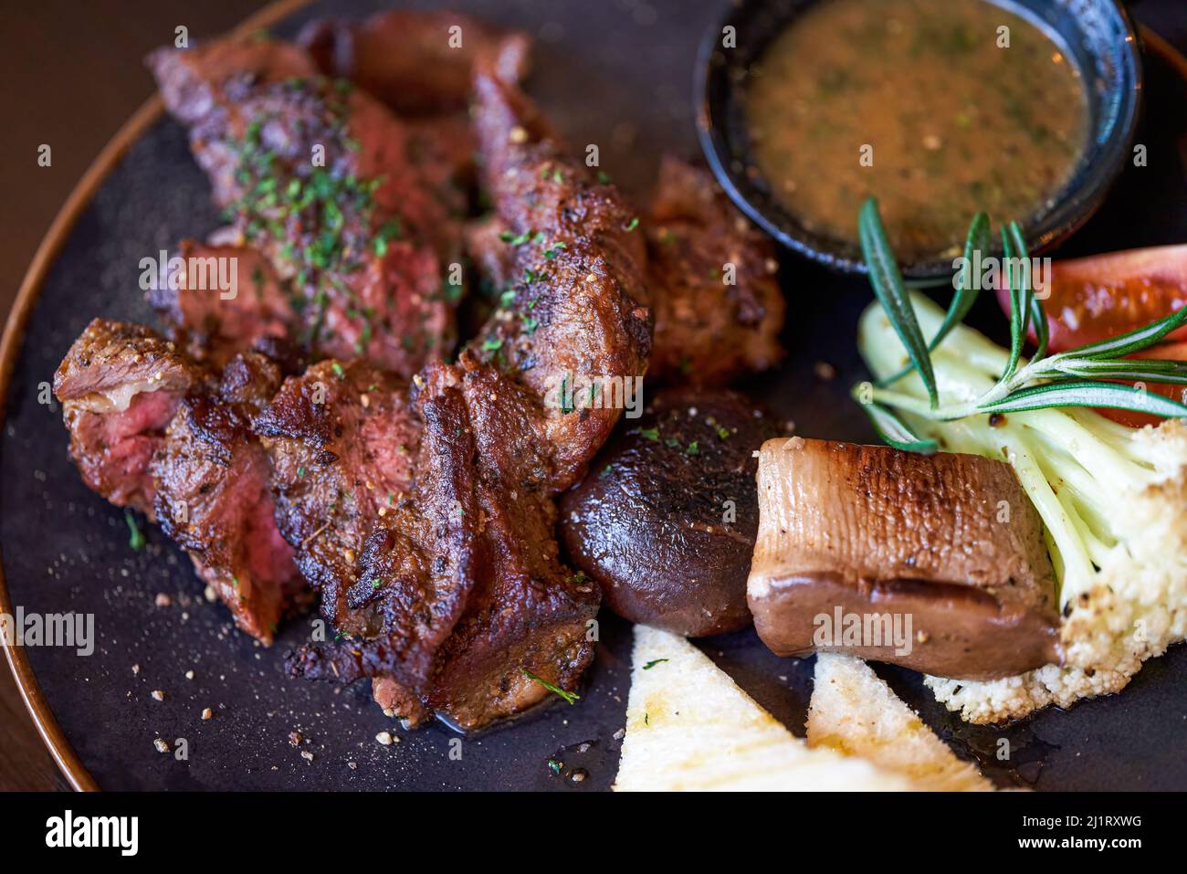 A delicious and tempting western steak, smoked grilled sirloin steak Stock Photo