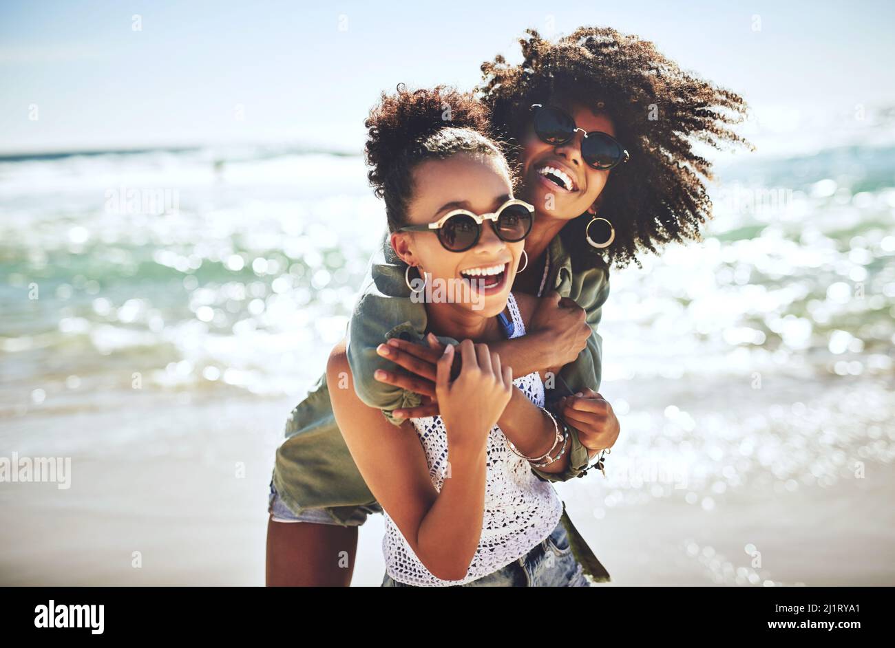 We missed the beach. Shot of two girlfriends enjoying themselves at the beach. Stock Photo