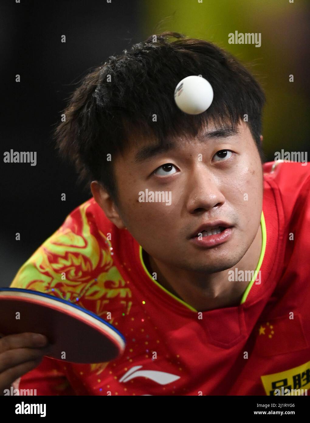 Doha, Qatar. 27th Mar, 2022. Zhao Zihao of China serves during the men ...