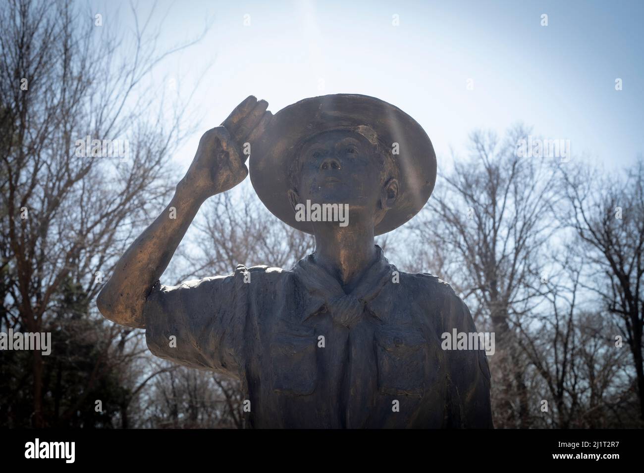 Boyscout statue is located at Ray Harral Nature Center in Broken Arrow, OK. This is a statue to remind young scouts to honor their values. Stock Photo