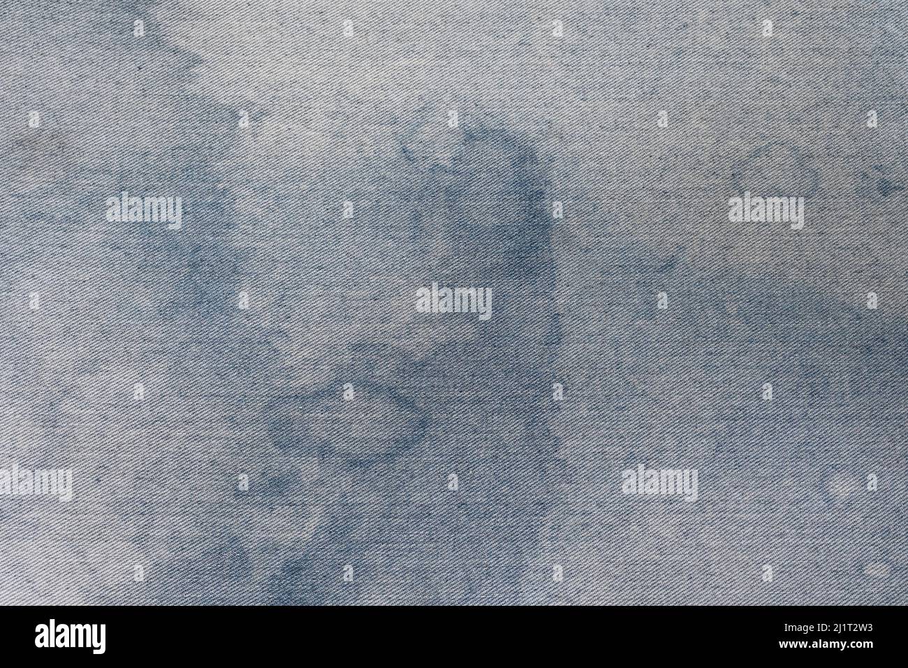 Blue abstract design stained white textured fabric for background Stock Photo