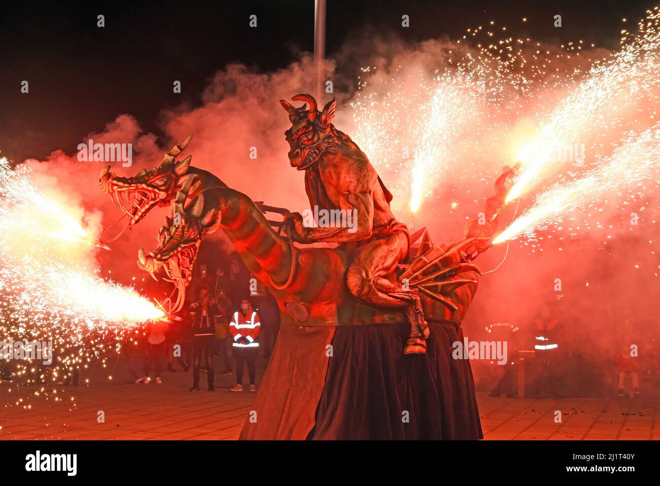 Vendrell, Spain. 5th Jan, 2022. A demonstrator carries a creature in the shape of a dragon that breathes fire, during the pyrotechnic display in solidarity with Ukrainian refugees in Vendrell. The association ''Drac de Foc El Cabrot de El Vendrell'' (Fire Dragon) acts in a pyrotechnic display in solidarity and support for people of Ukrainian nationality who are refugees in hotels and municipal hostels in the city of Vendrell due to the invasion of Russia of Ukraine, The performance of parades of fire is a Catalan tradition that takes place in towns and cities every year. (Credit Image: © Ram Stock Photo