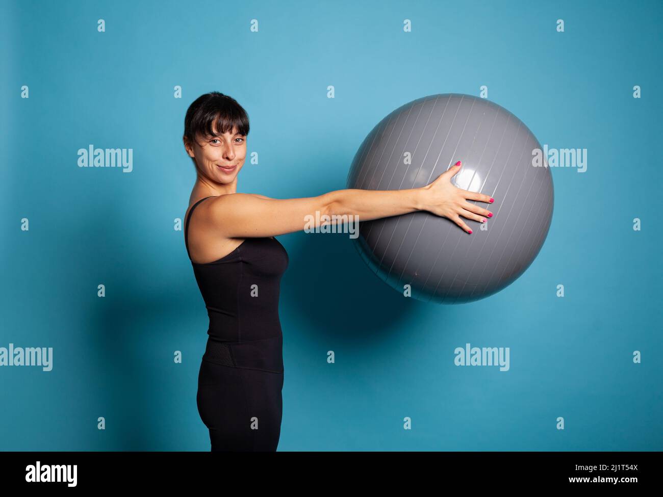 Classic Pilates with Props. Athletic Woman Practice Shoulder Bridge with a  Small Fit Ball Under Her Feet, Isolated on Stock Image - Image of body,  activity: 239190333