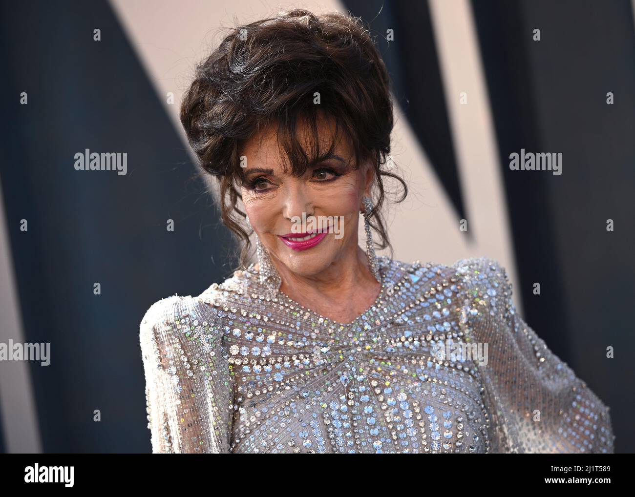 Joan Collins on the red carpet at the 2022 Vanity Fair Oscar Party held