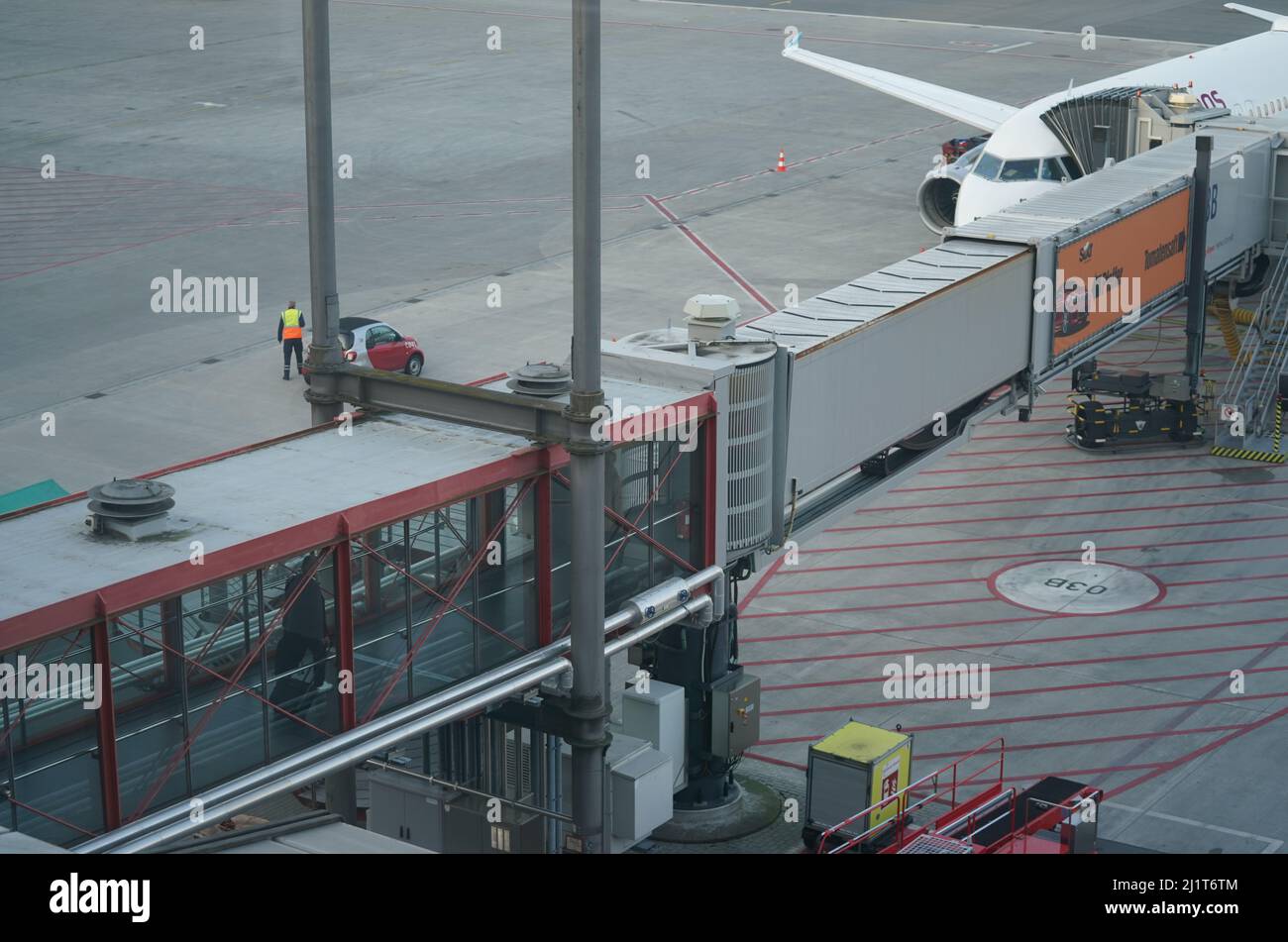 Hamburg, Germany. 23rd Mar, 2022. A gangway leads to a passenger aircraft at a terminal of Hamburg Airport. Hamburg Airport takes stock of the past year 2021 and provides an outlook for the current fiscal year on March 28, 2022. Credit: Marcus Brandt/dpa/Alamy Live News Stock Photo