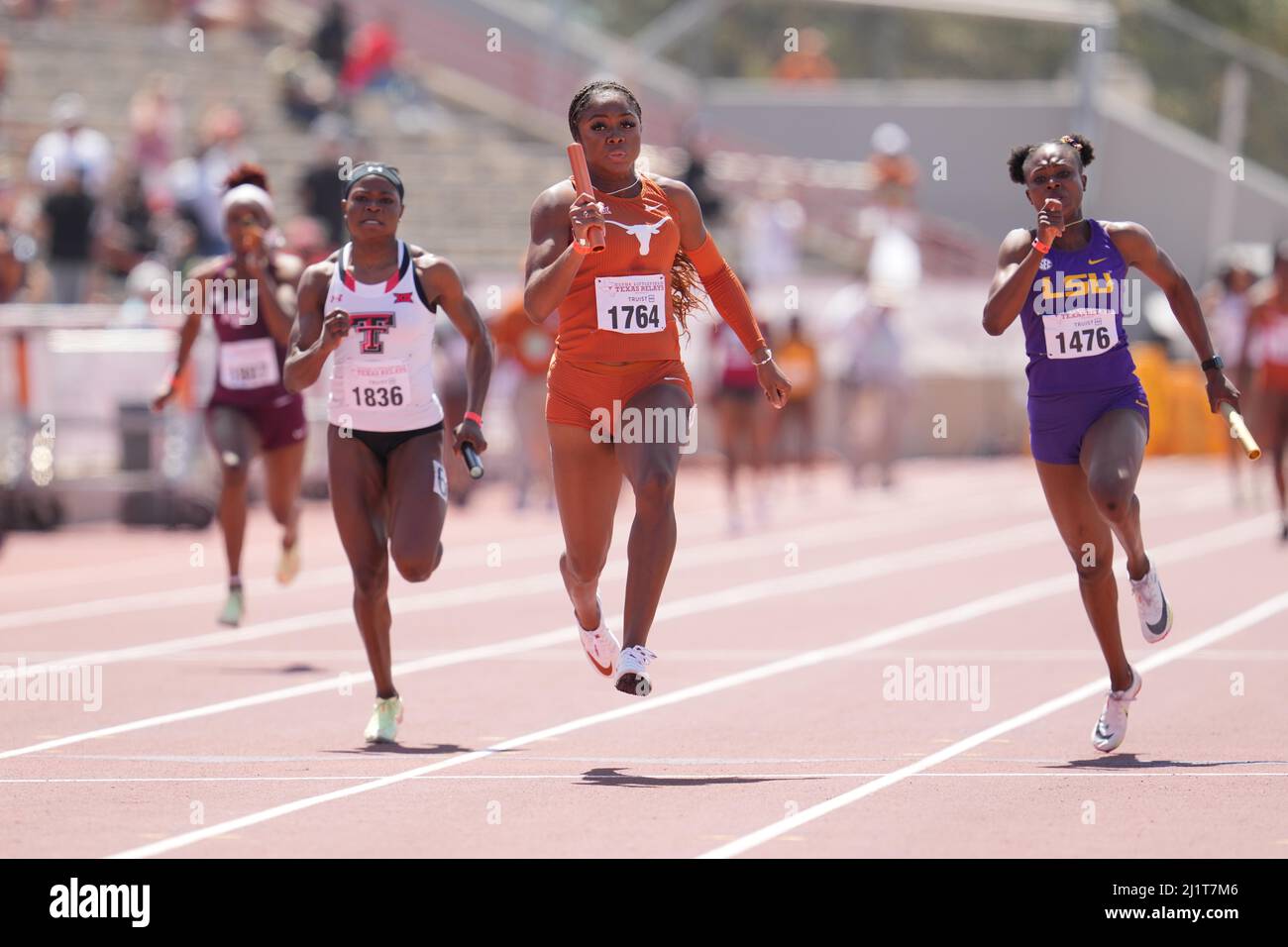 Kynnedy Flannel of Texas (1764) defeats Favour Ofili of LSU (1476) on the anchor leg of the women's 4x100m relay, 42.83 to 42.97, during the 94th Clyd Stock Photo